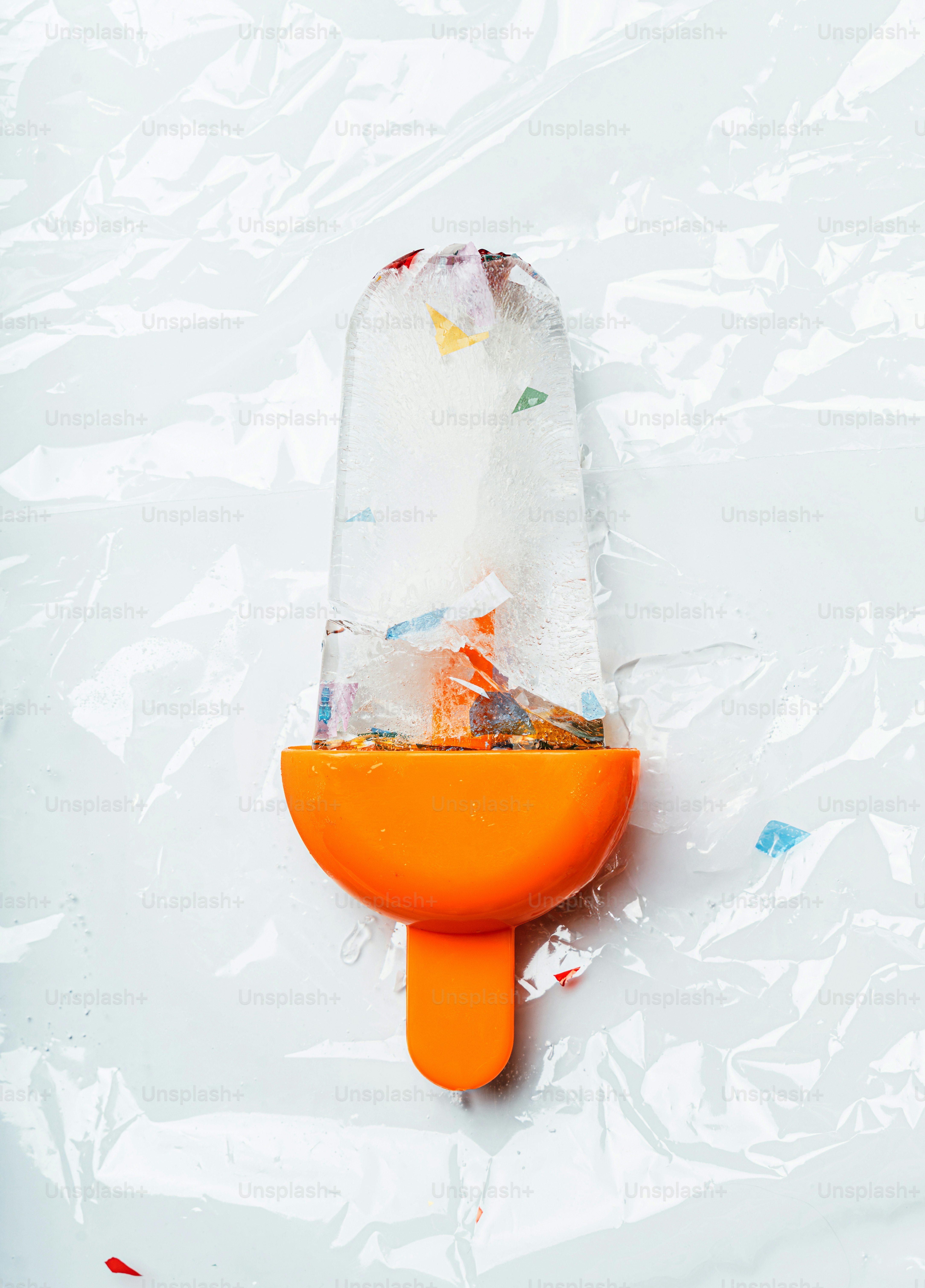 Ice pop with colorful debris frozen inside