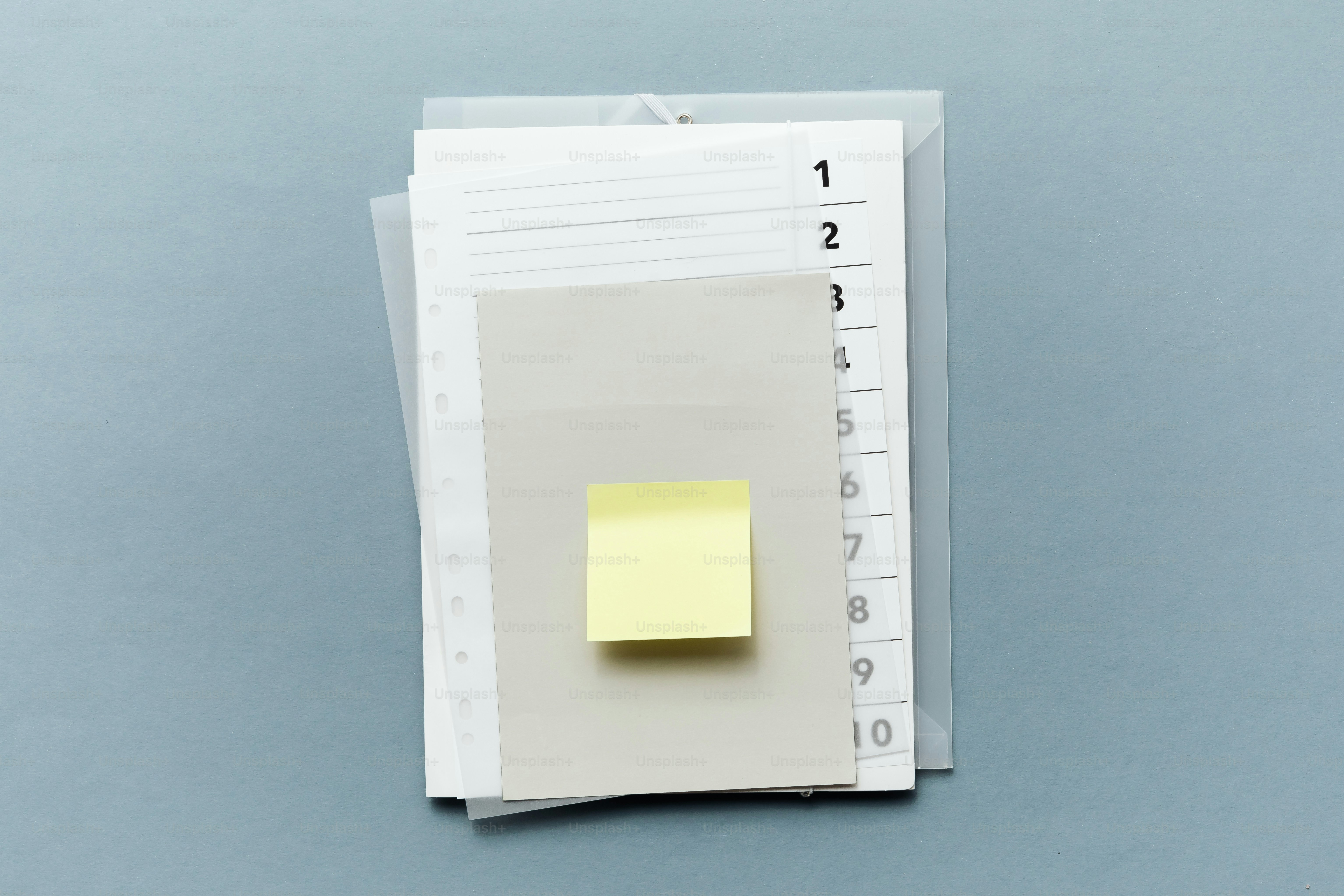 A yellow sticky note on a planner