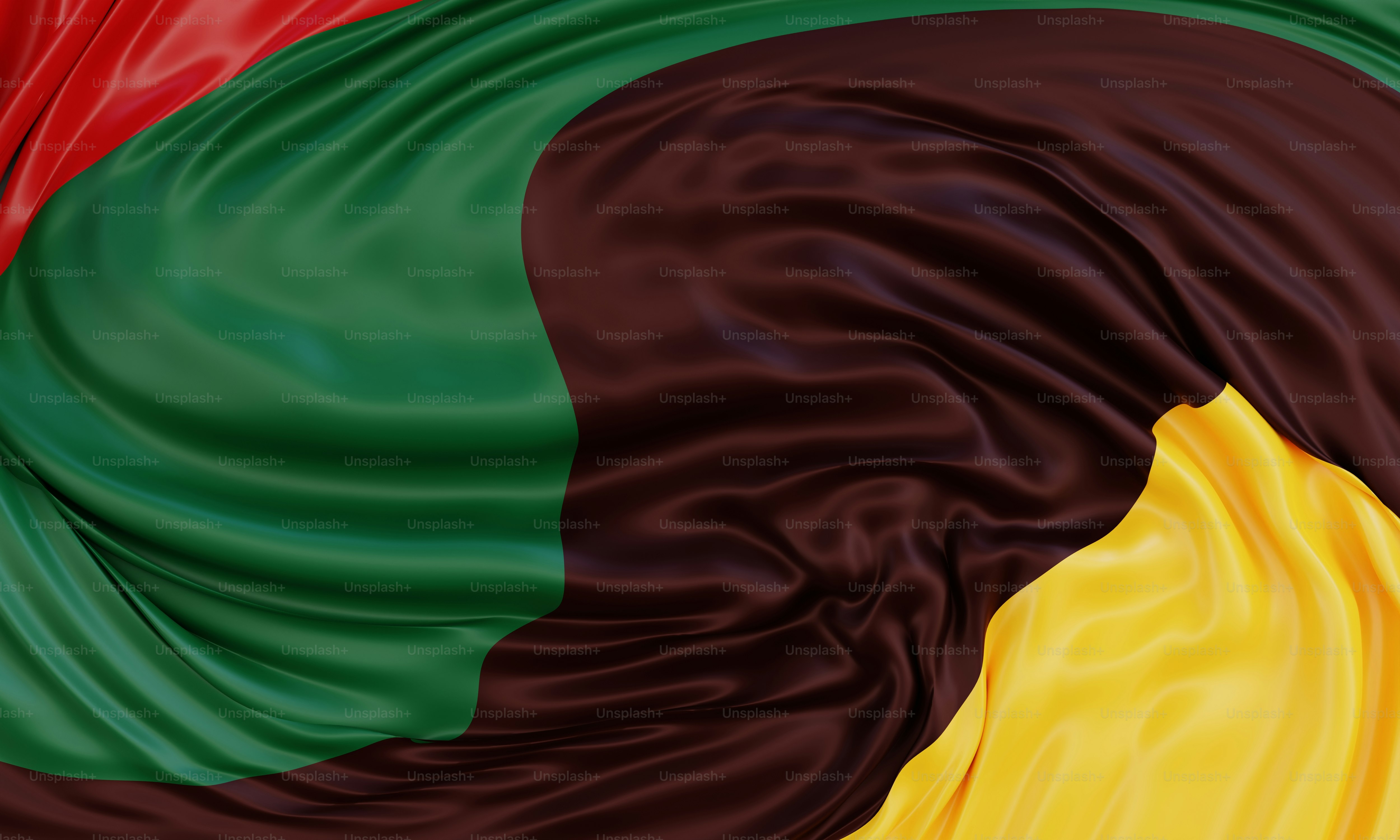Tessuto astratto e fluido con colori rosso, verde, marrone e giallo.