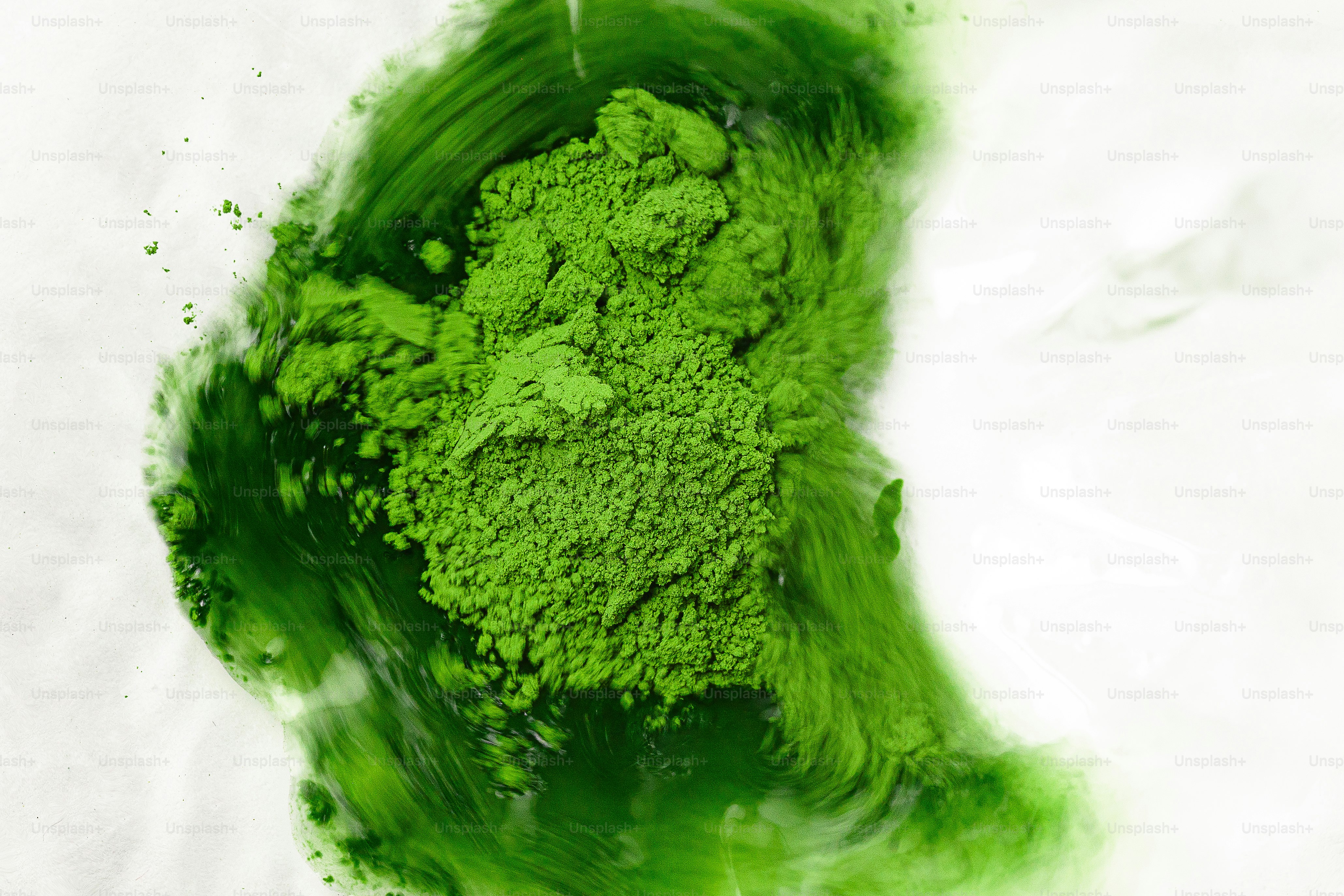 Green powder being mixed with liquid photo – Matcha Image on Unsplash