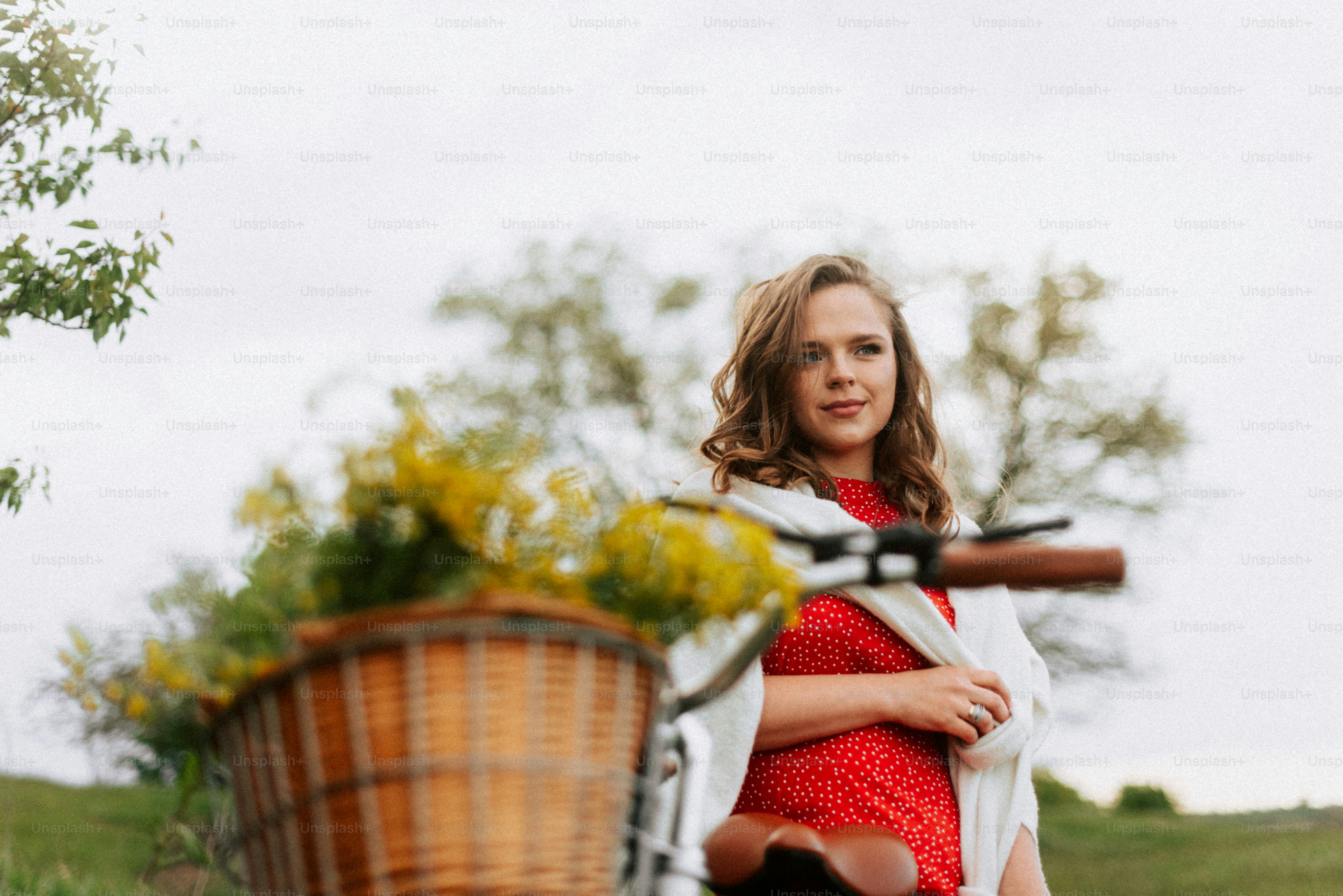 Woman with bicycle and flowers in basket