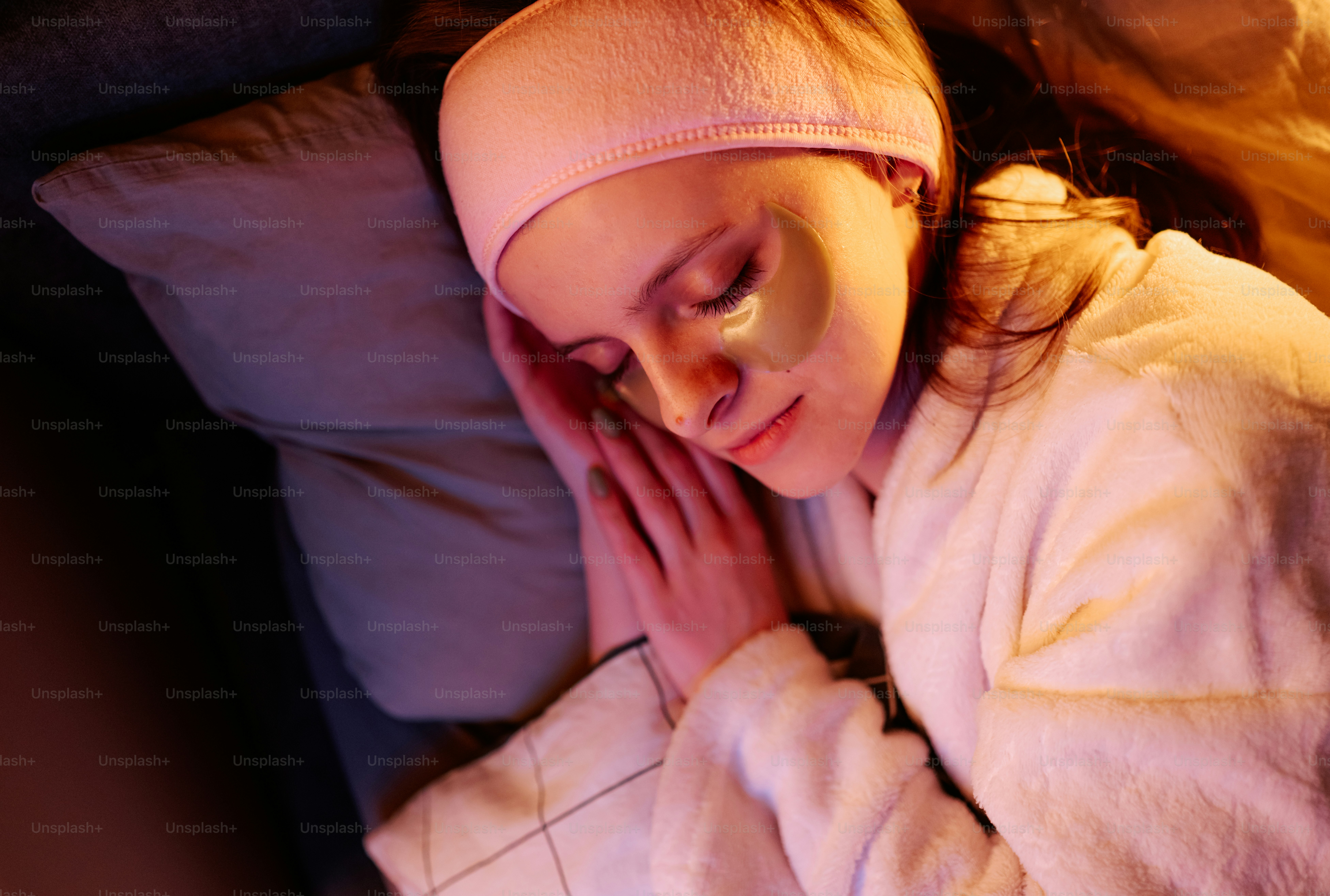 Young woman sleeping with eye patches