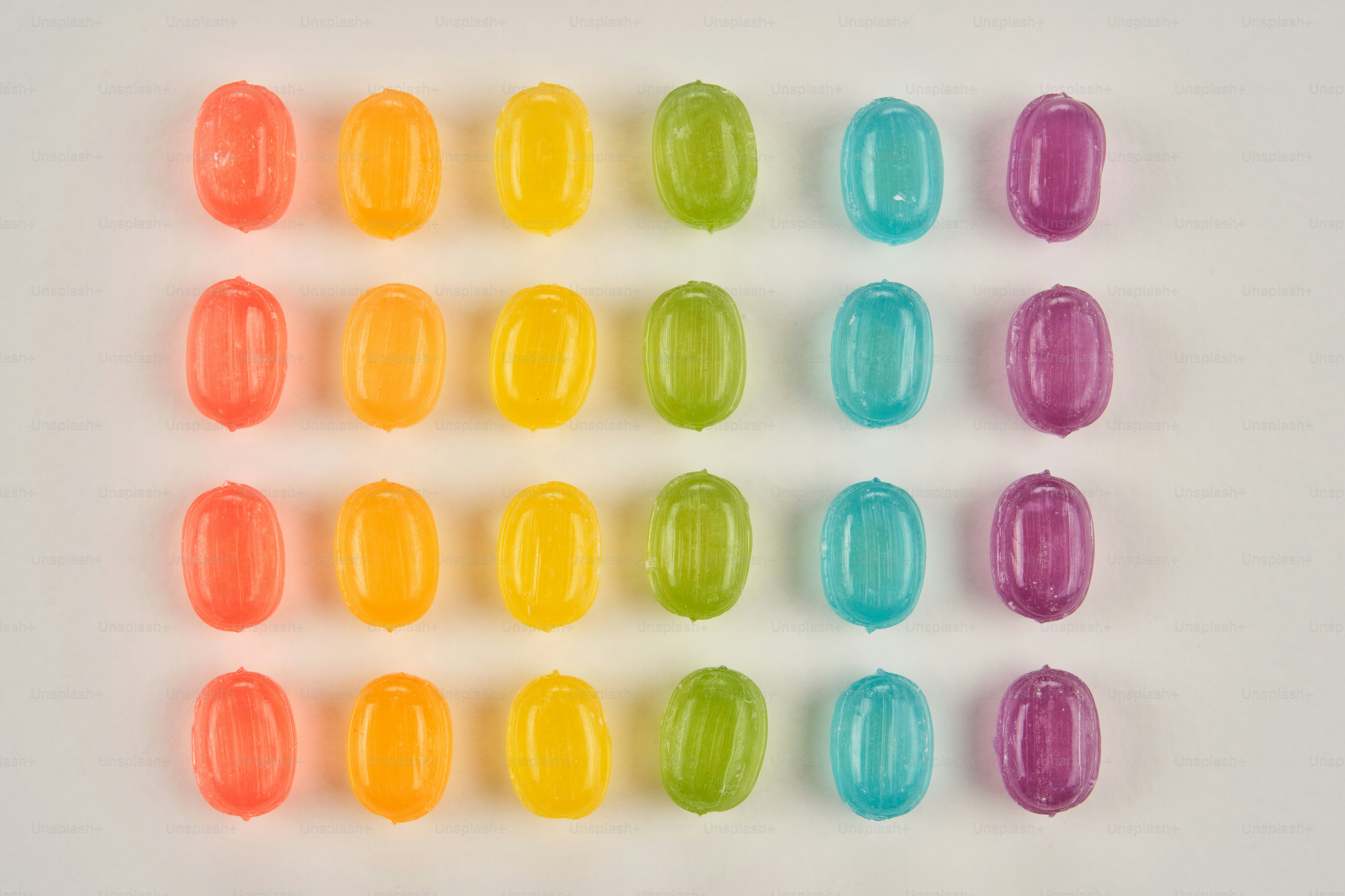 Rows of colorful oval beads on a white background