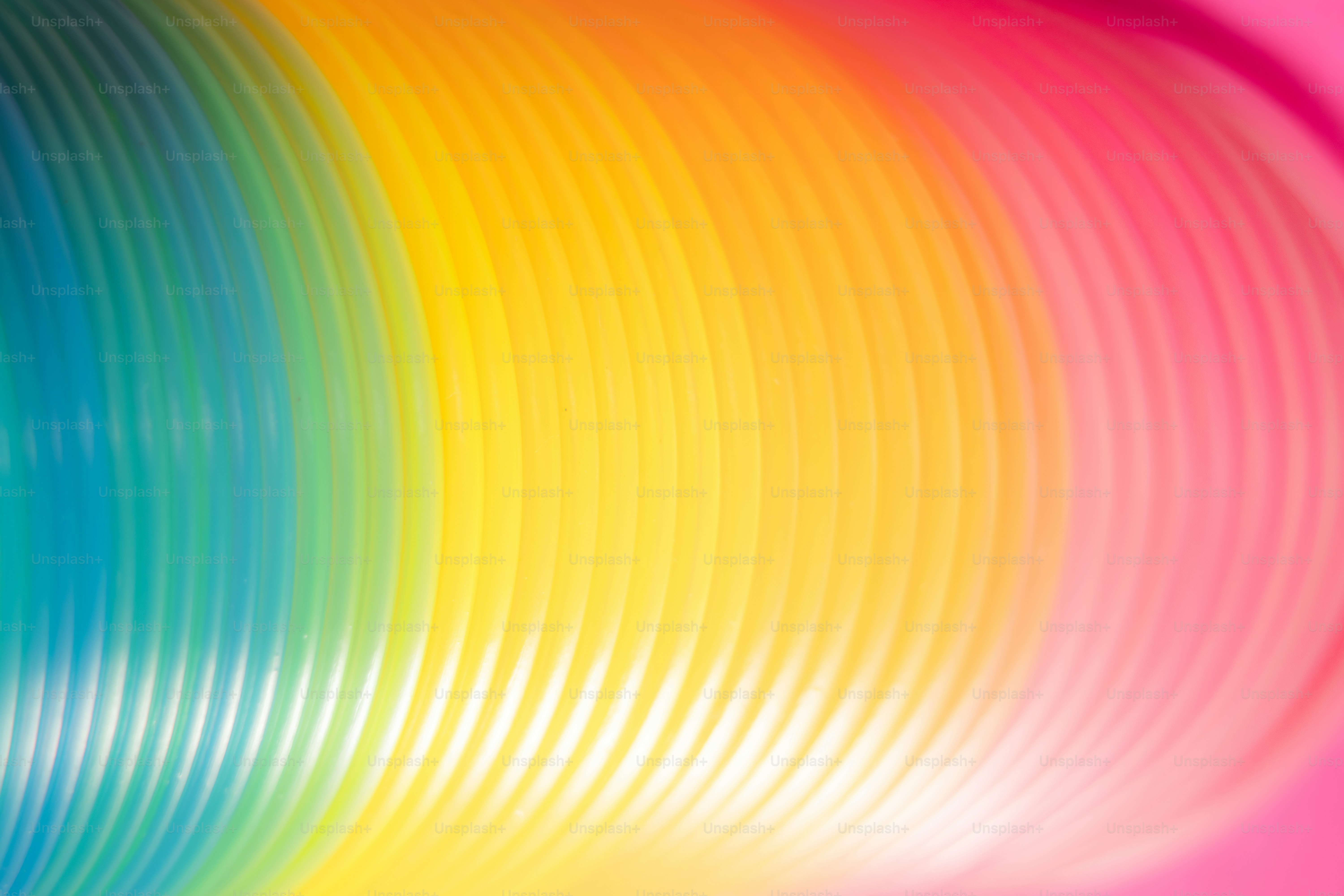 Rainbow colored slinky coils close up