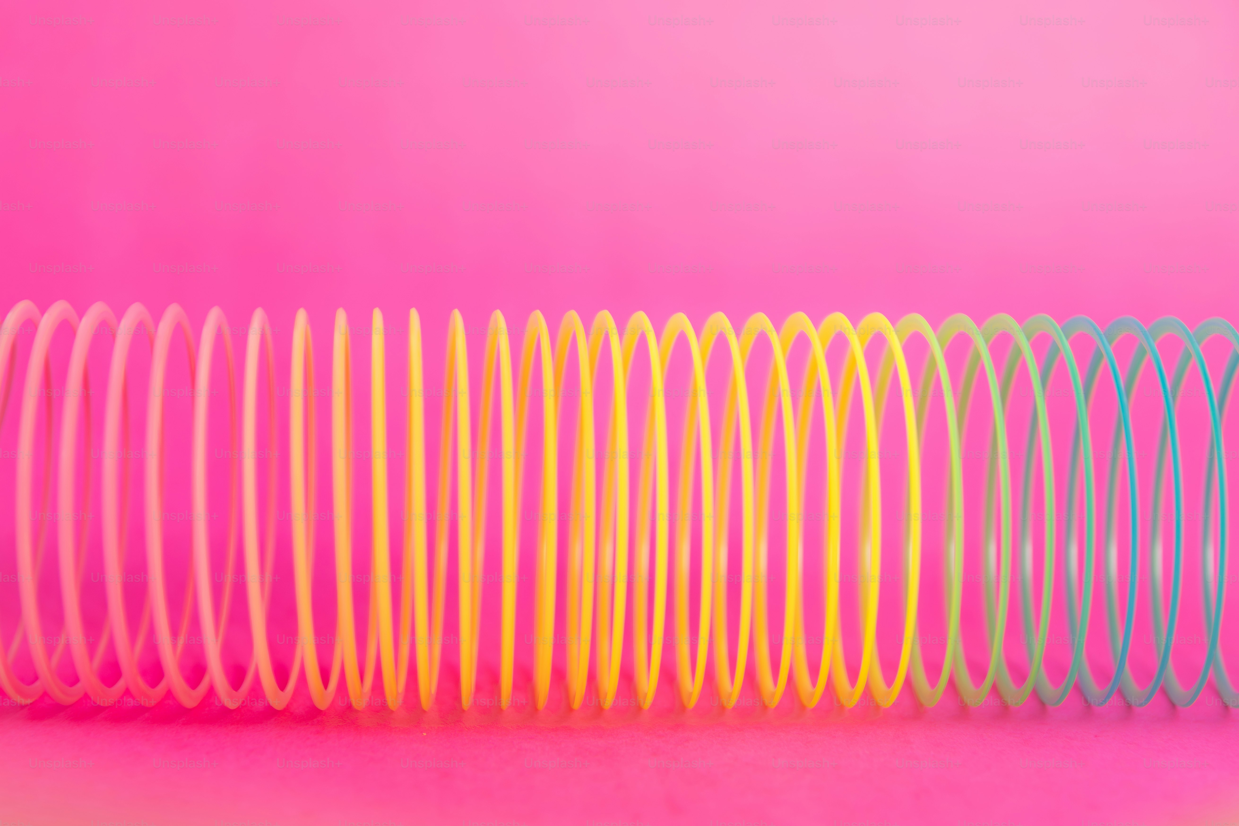 Rainbow colored slinky coils close up photo – Wallpaper Image on Unsplash