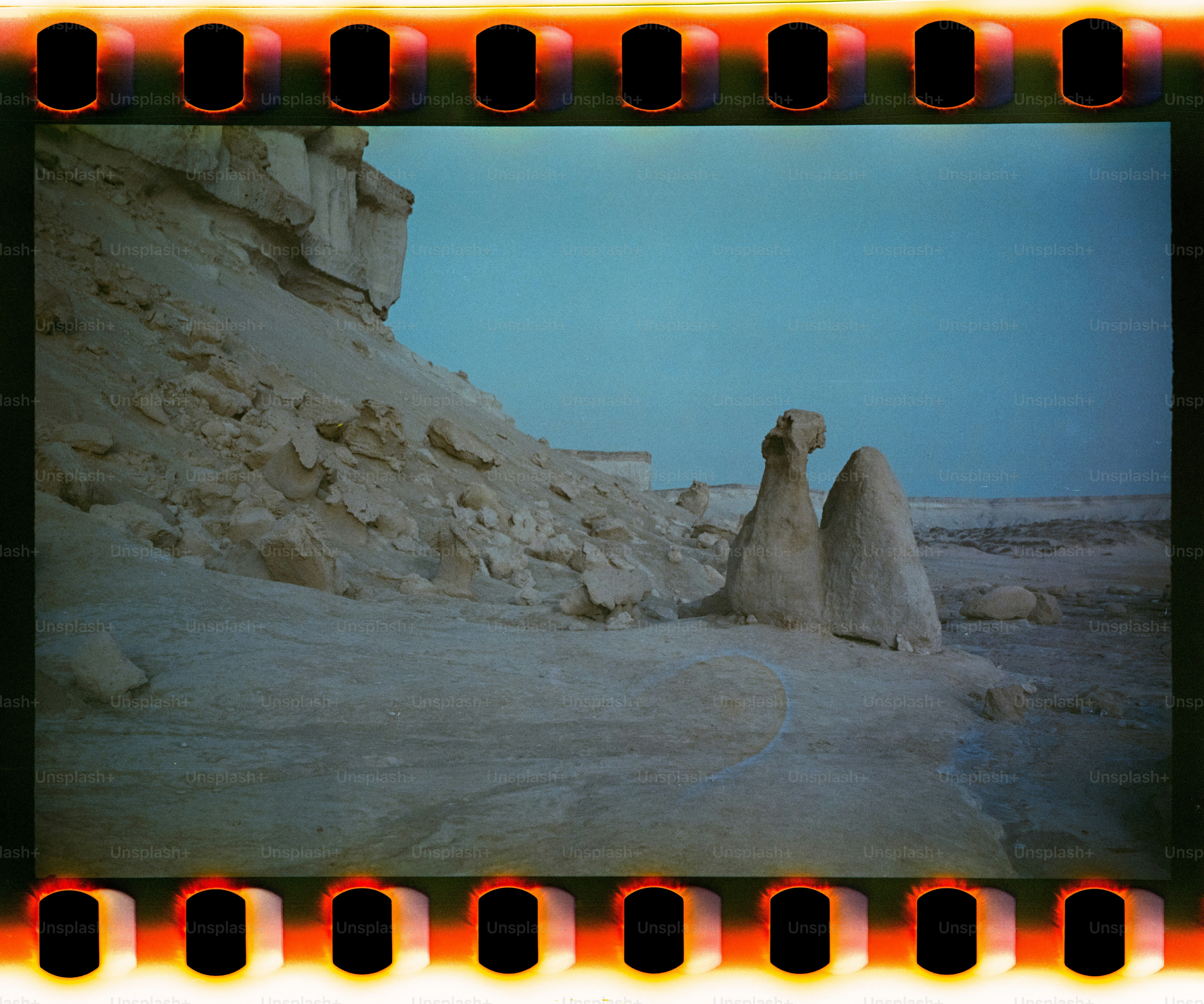 Desert landscape with rock formations and clear blue sky
