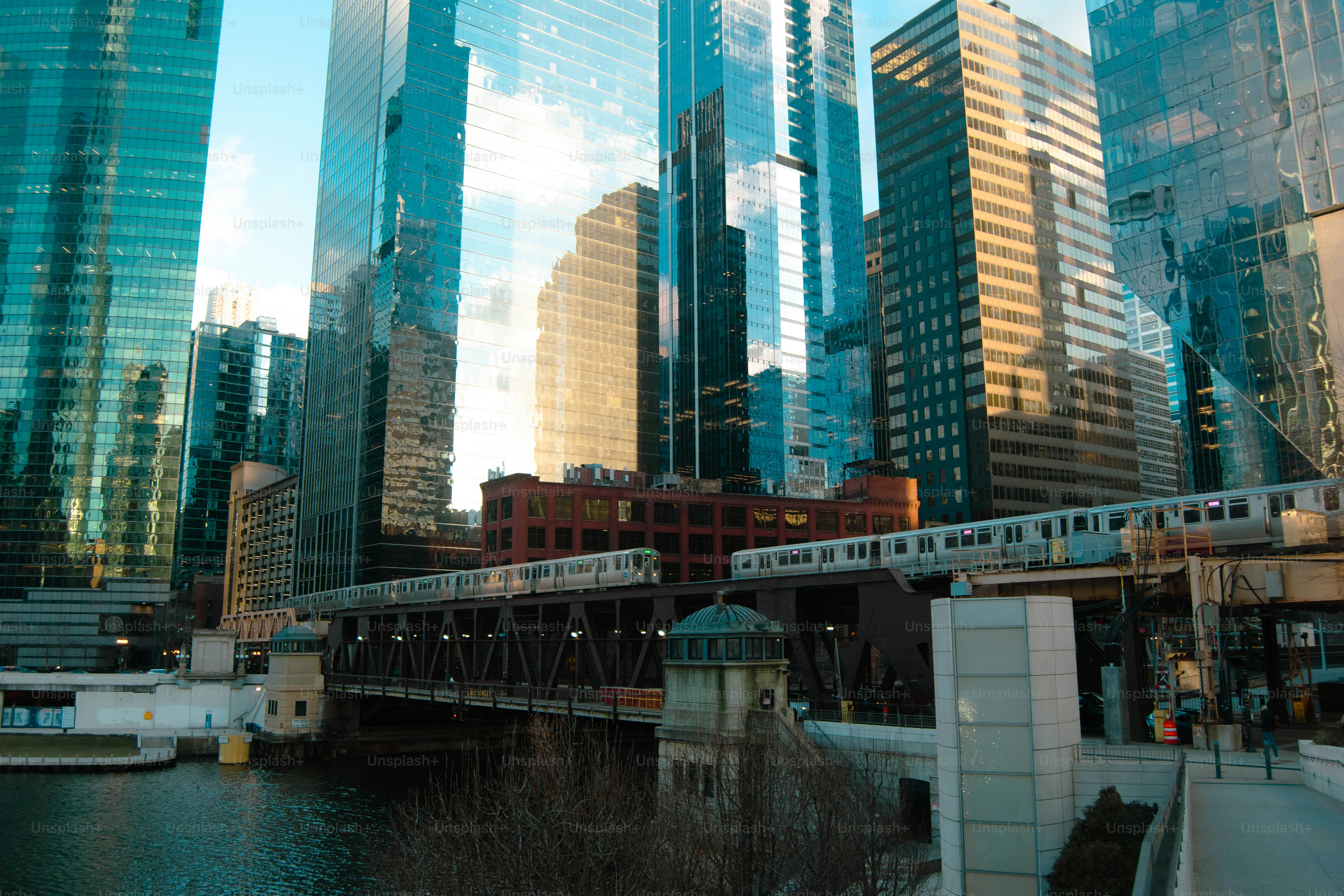 Cityscape with a river and bridge at sunset. photo – Building Image on ...