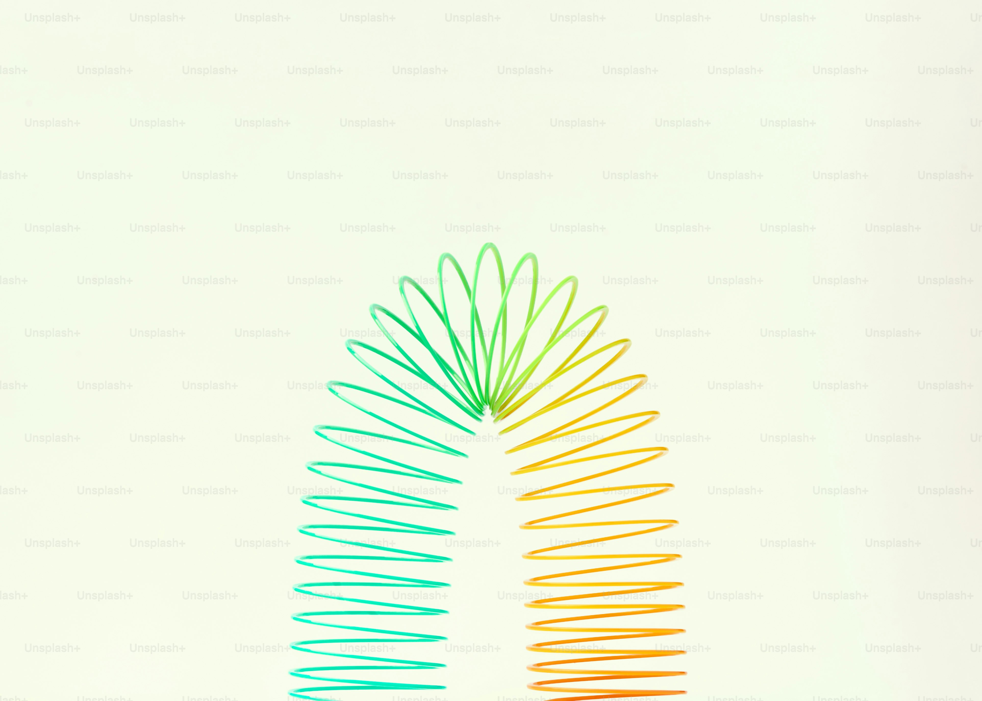 A colorful slinky toy against a white background