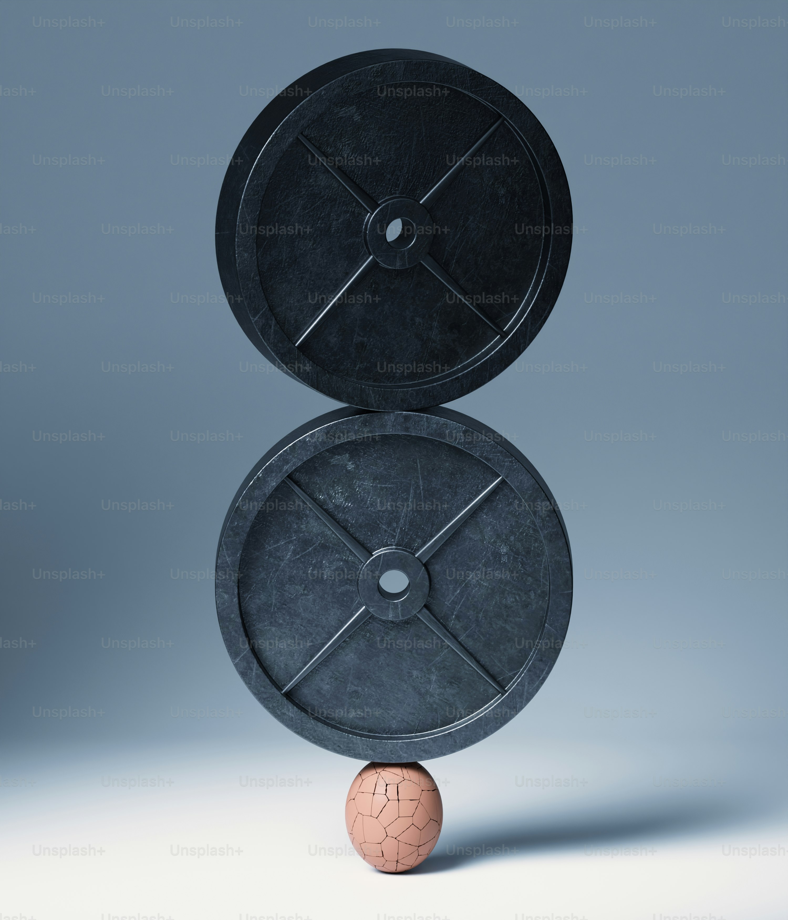Duas placas de peso equilibradas em uma pequena esfera.