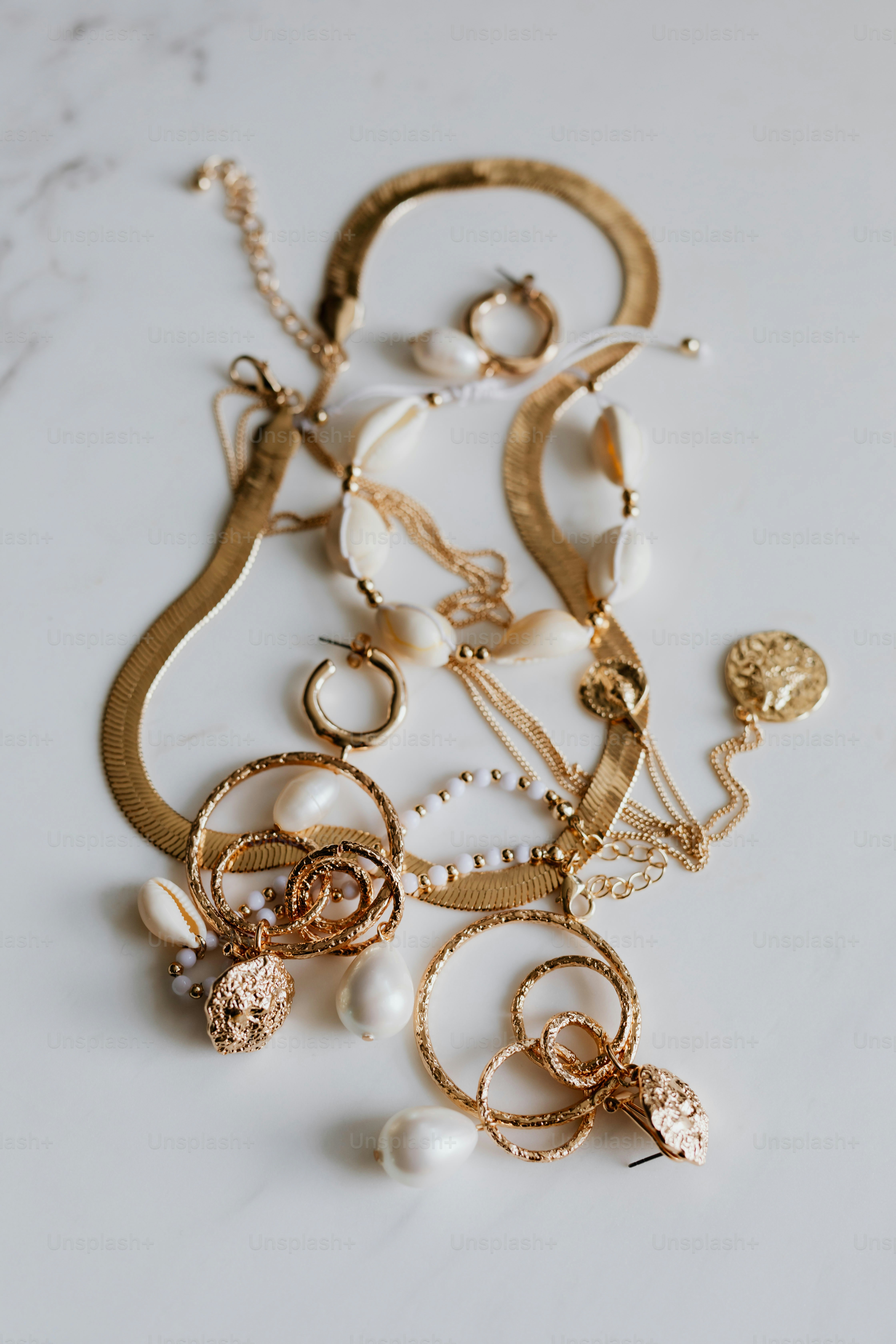 Collection of gold necklaces, earrings and rings