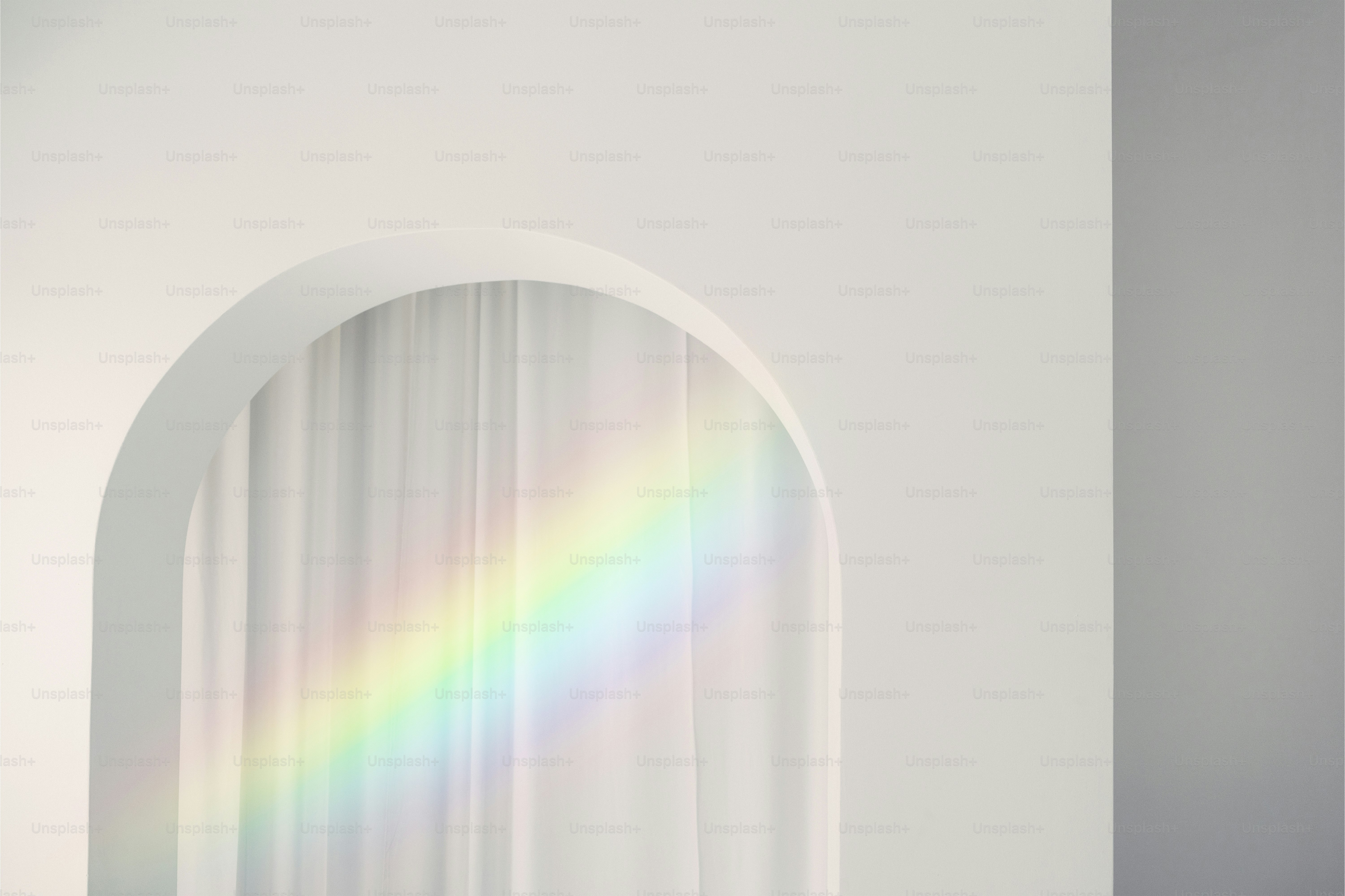 Archway with rainbow light refraction on white curtain