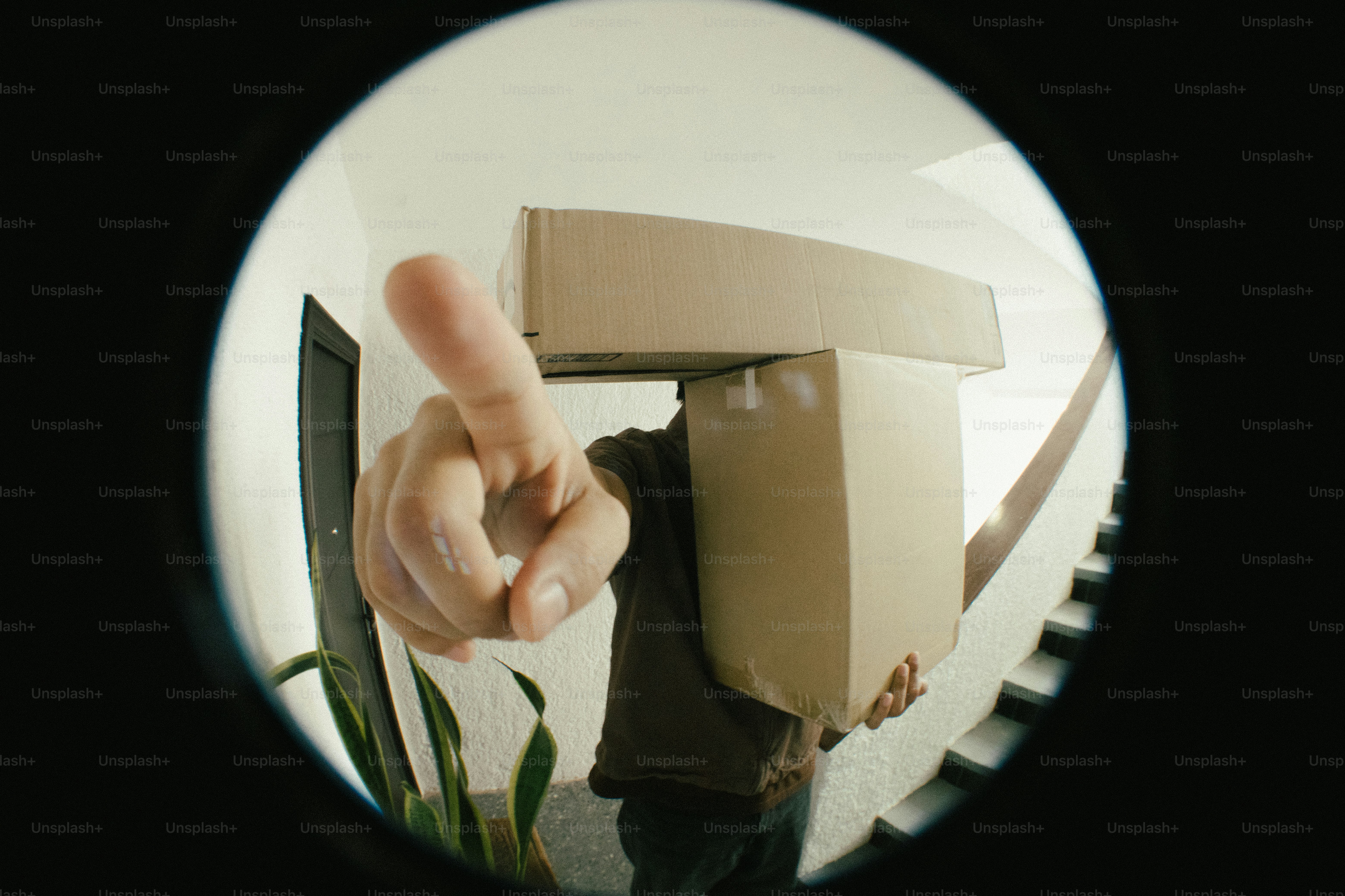 Person carrying boxes with finger raised photo – Logistics Image on ...