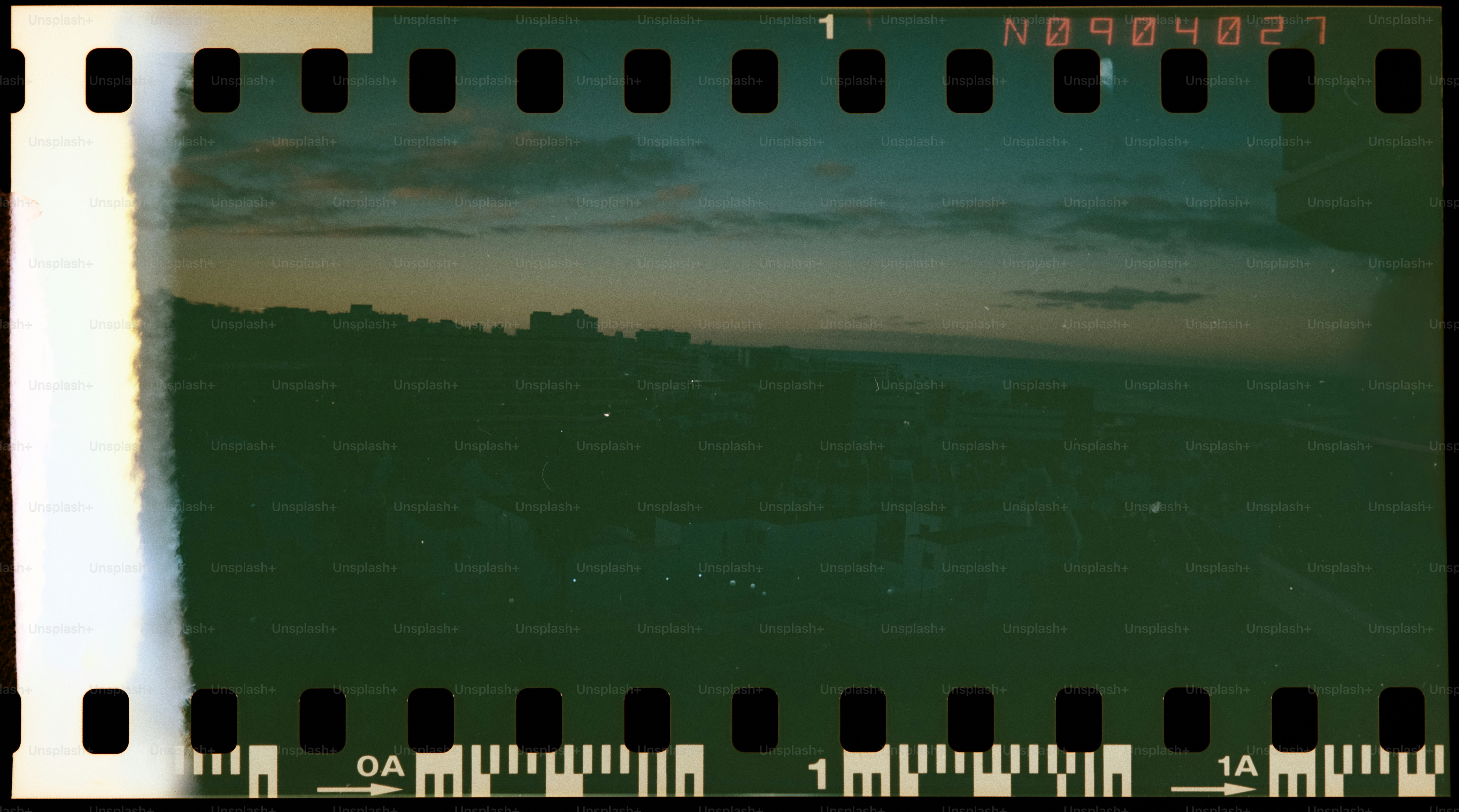 Cityscape at dusk with film strip border
