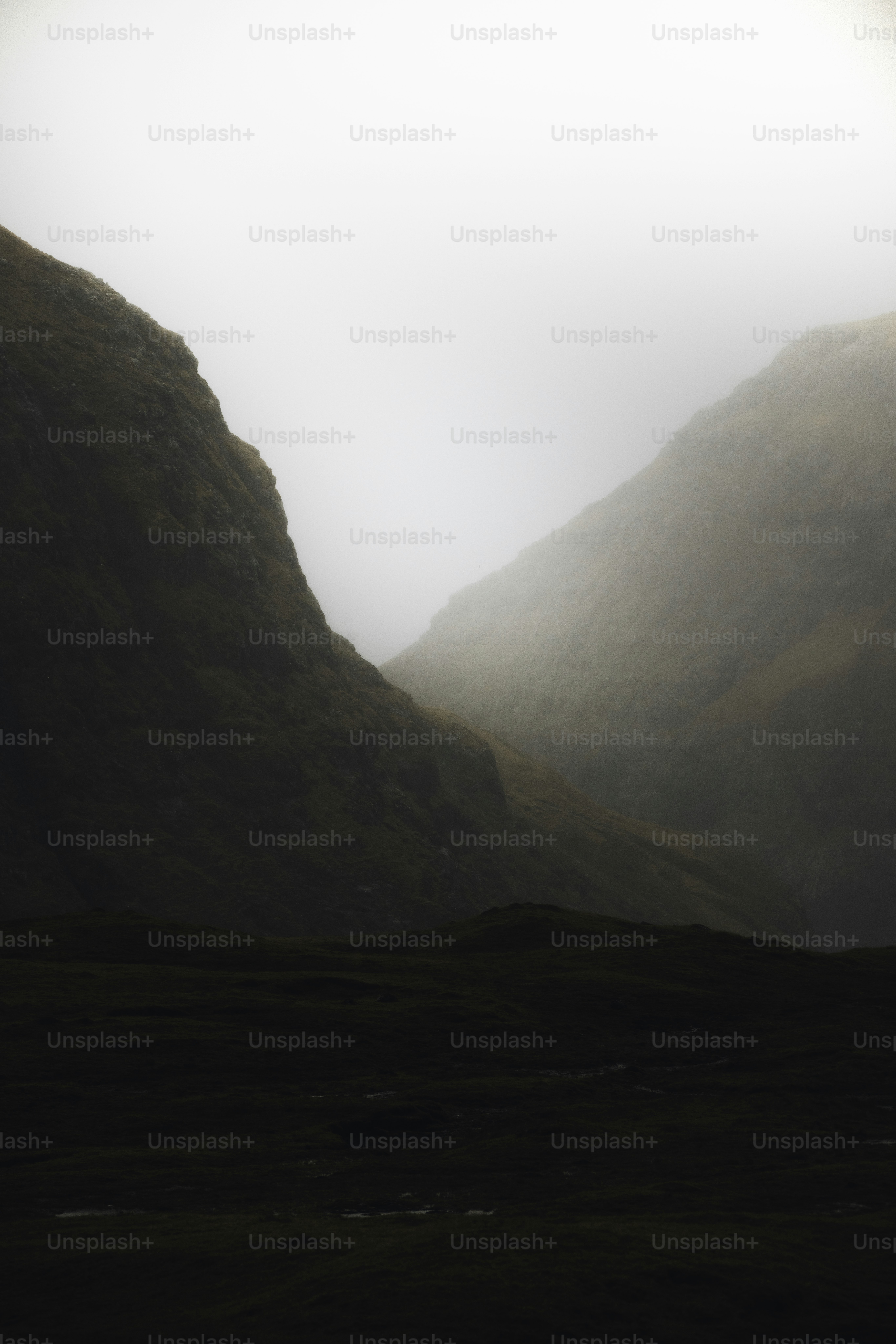 Misty mountains with dark foreground