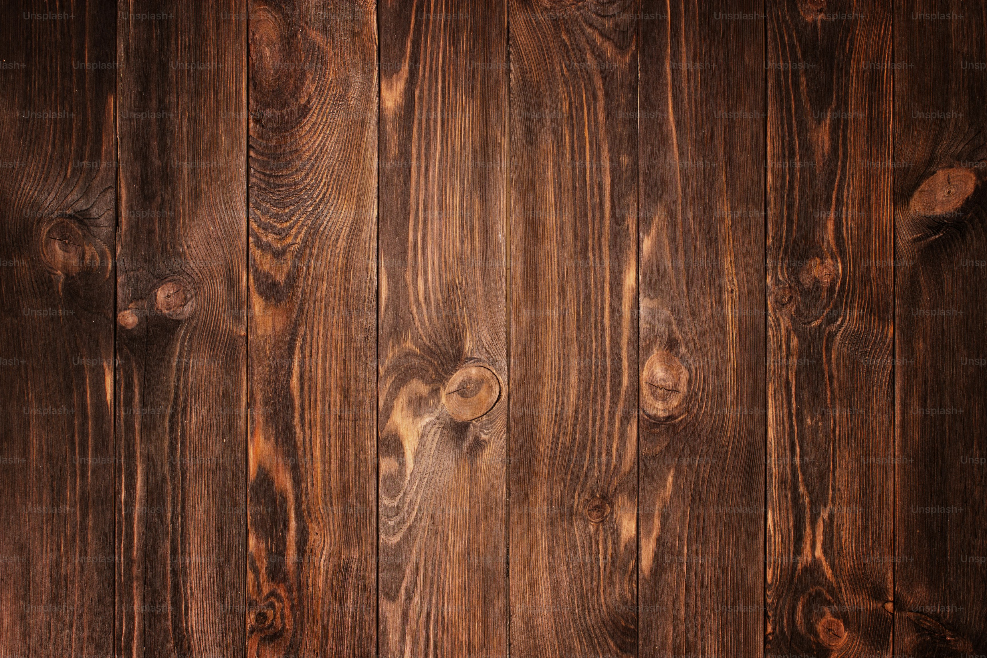dark stained, distressed wooden floor board texture
