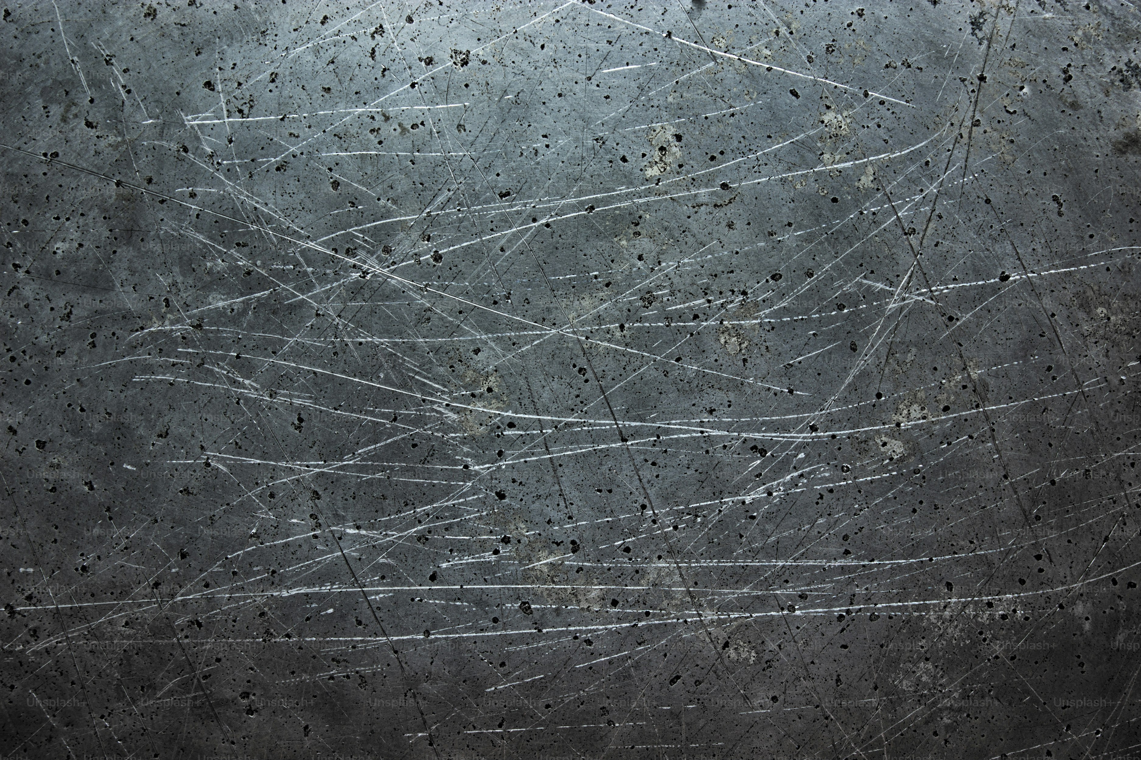 dark metal background, gray texture steel stains from the brush