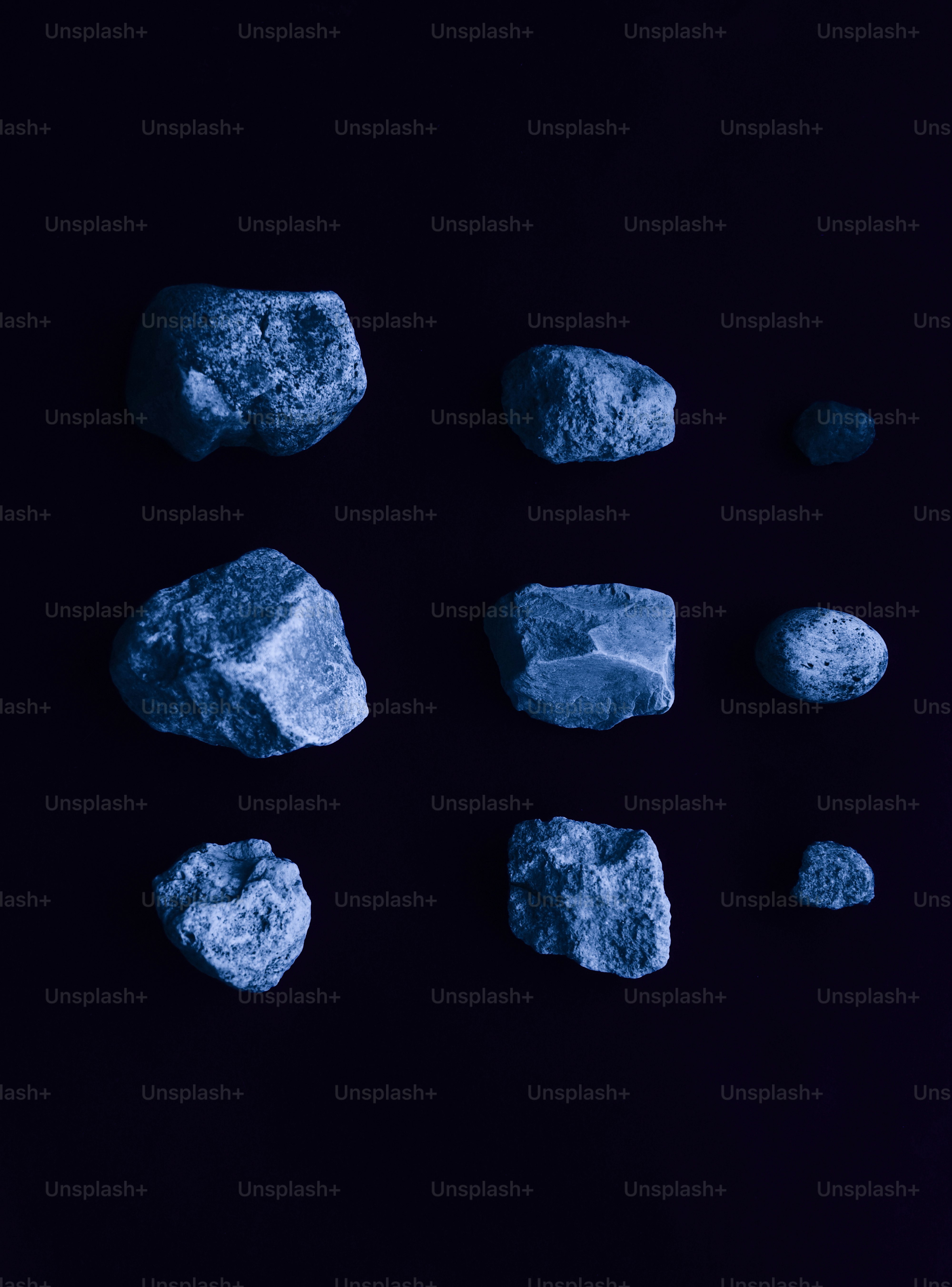 Collection of rough stones on a dark background.