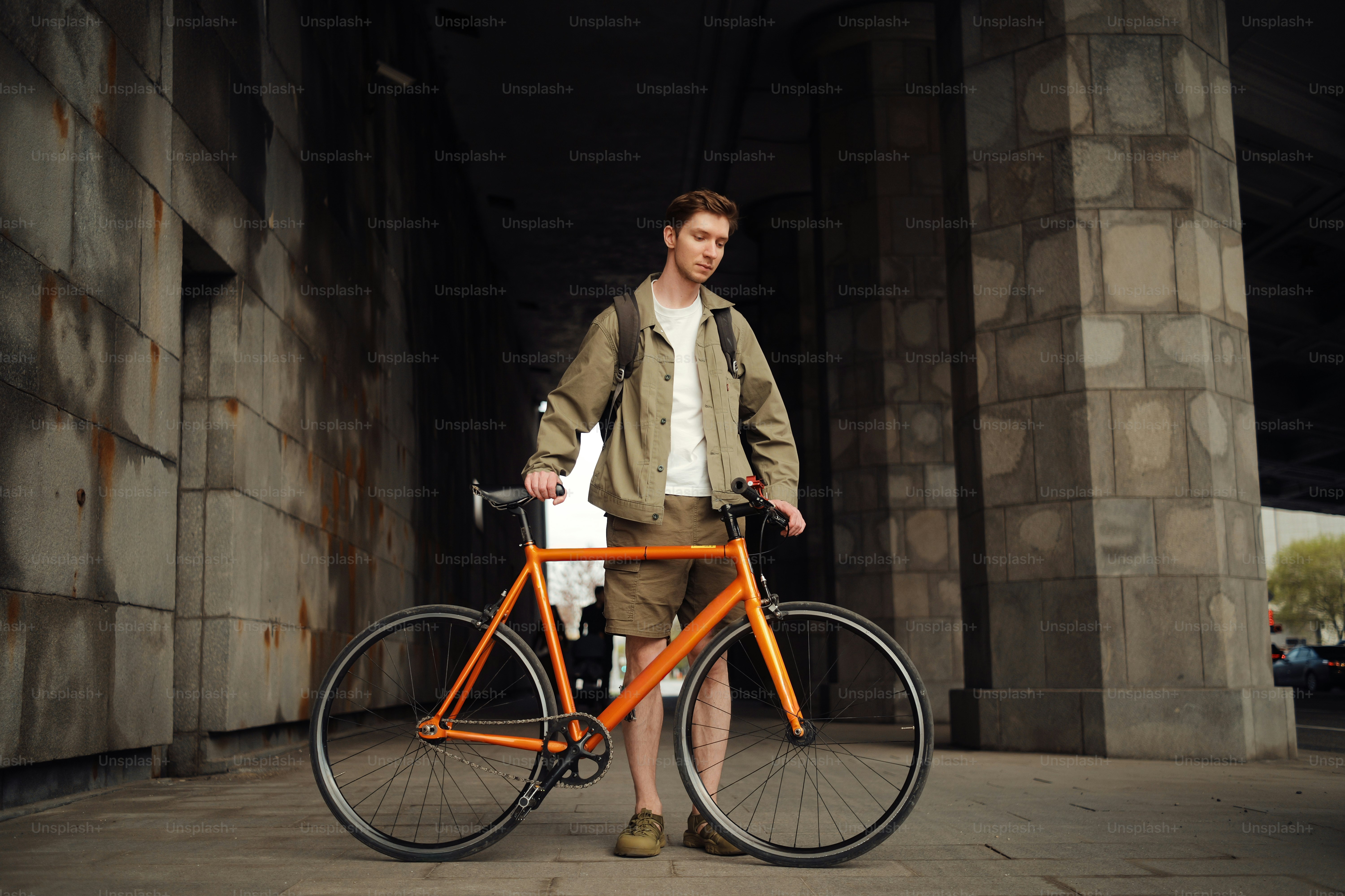 Man riding a bicycle on a city street photo – Freedom Image on Unsplash