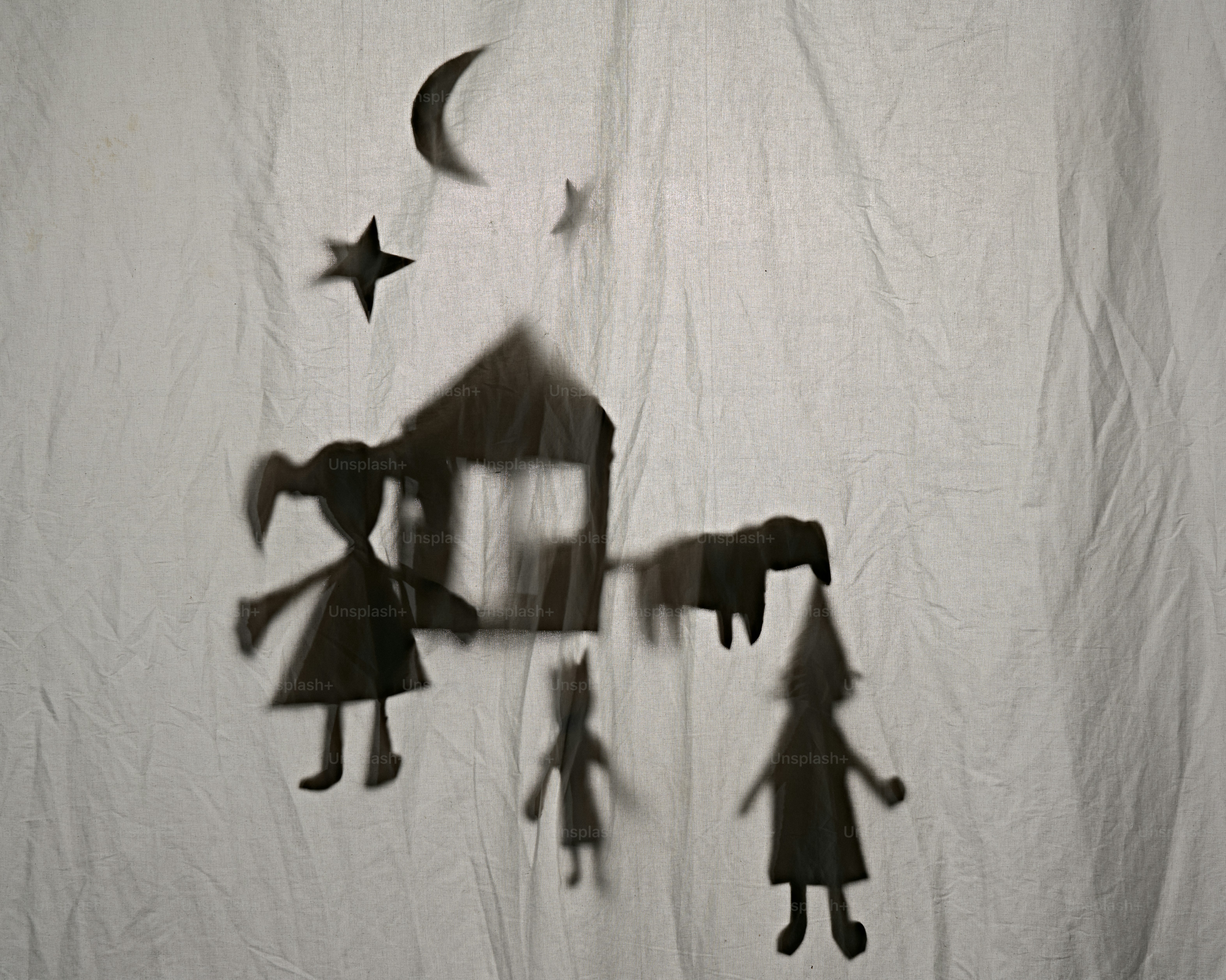Shadow puppets of a house, people, and animals under moon. photo – Moon ...