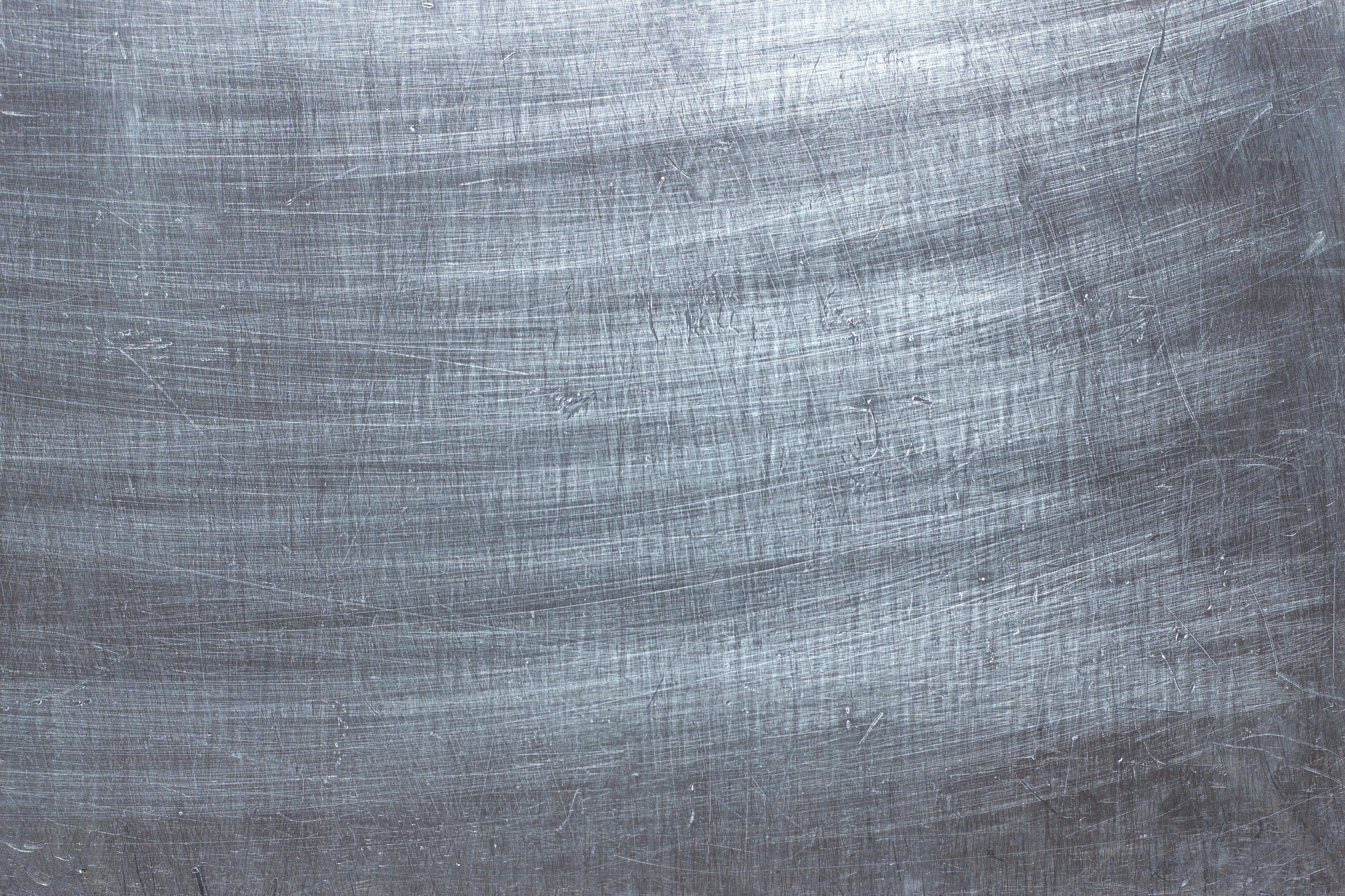 Aluminum plate as background, metal texture with scratches on the surface
