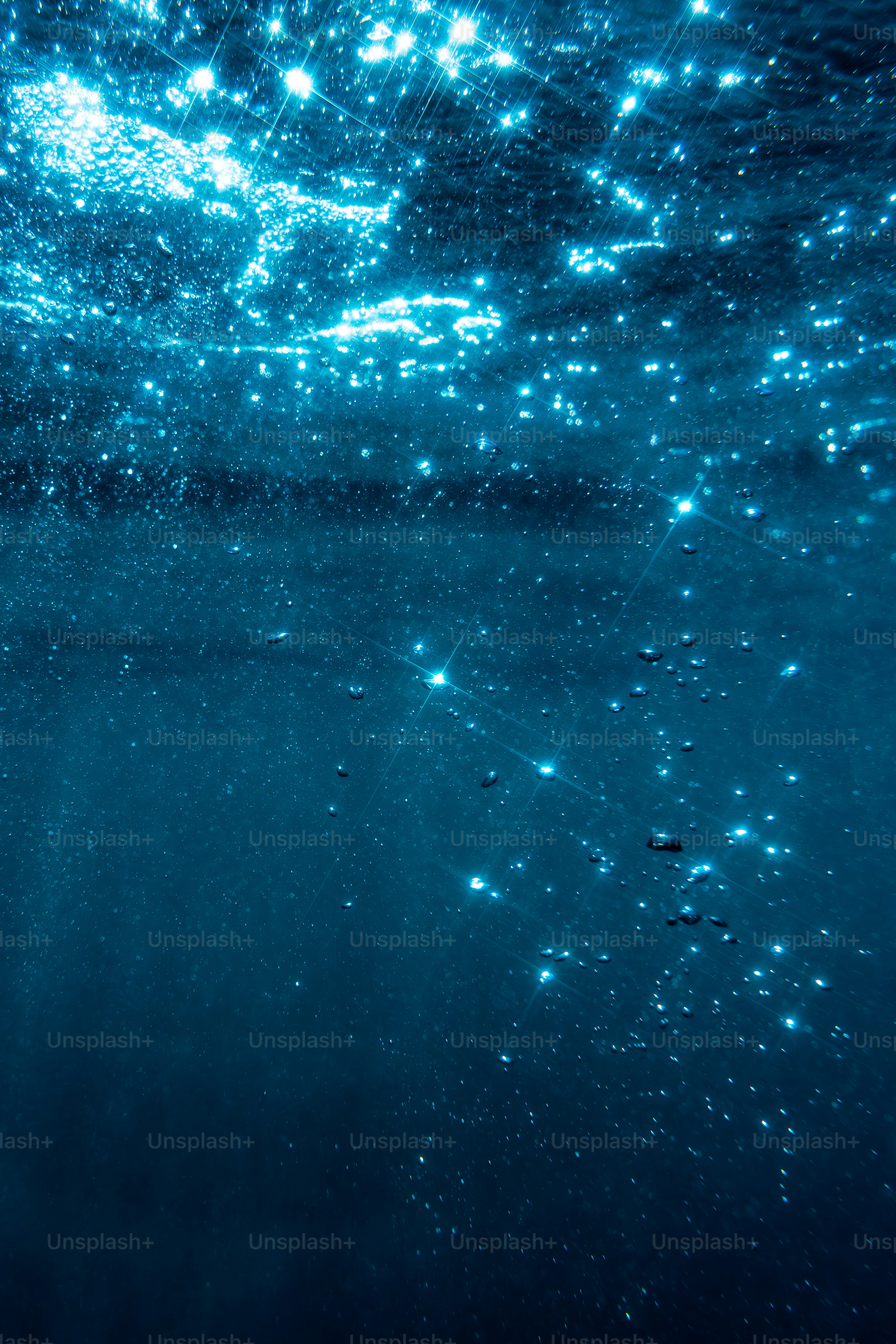 Sparkling light on deep blue water surface