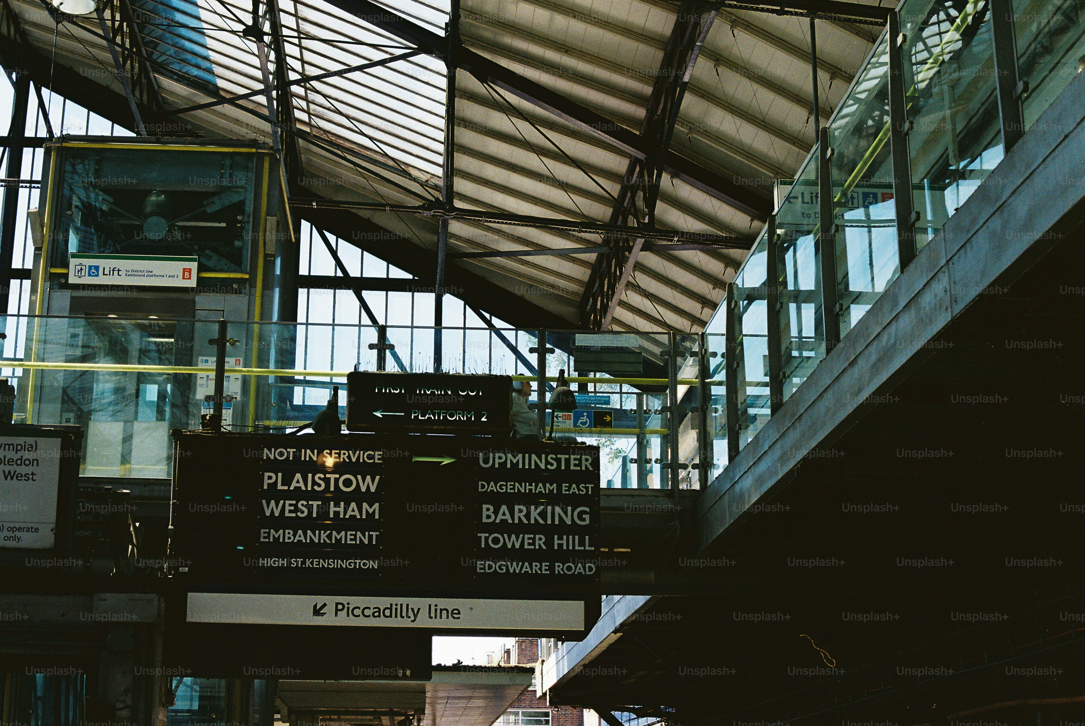 Train station signs showing destinations and platforms