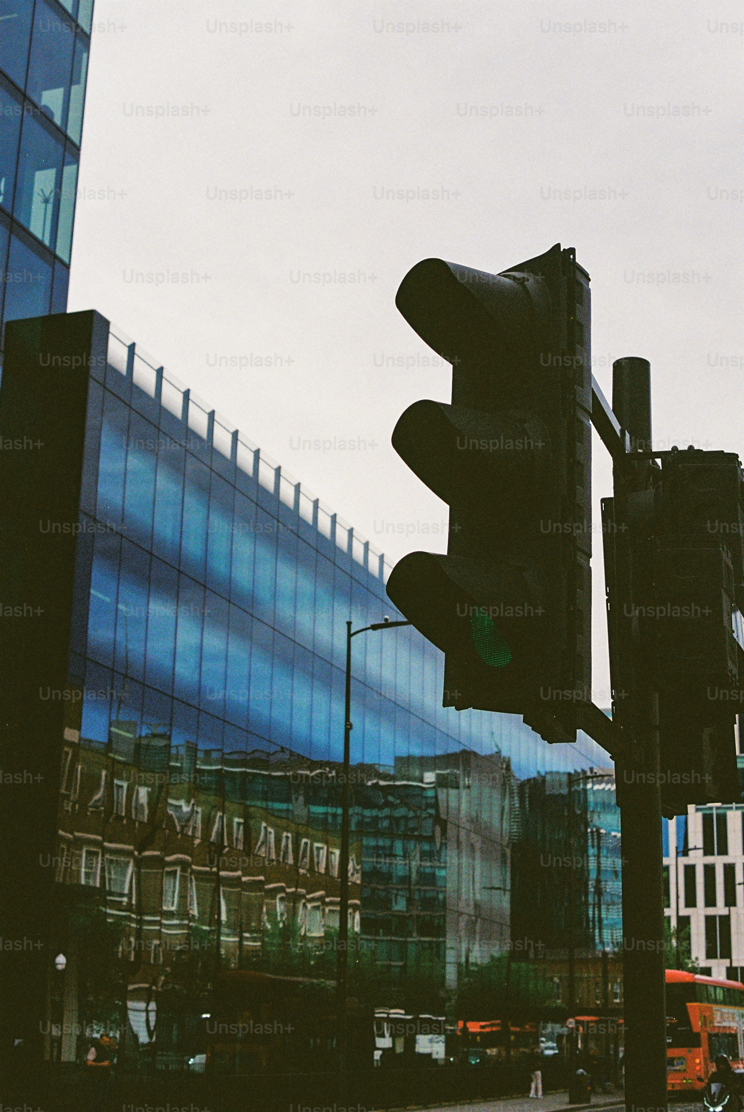 Traffic light in front of modern glass buildings