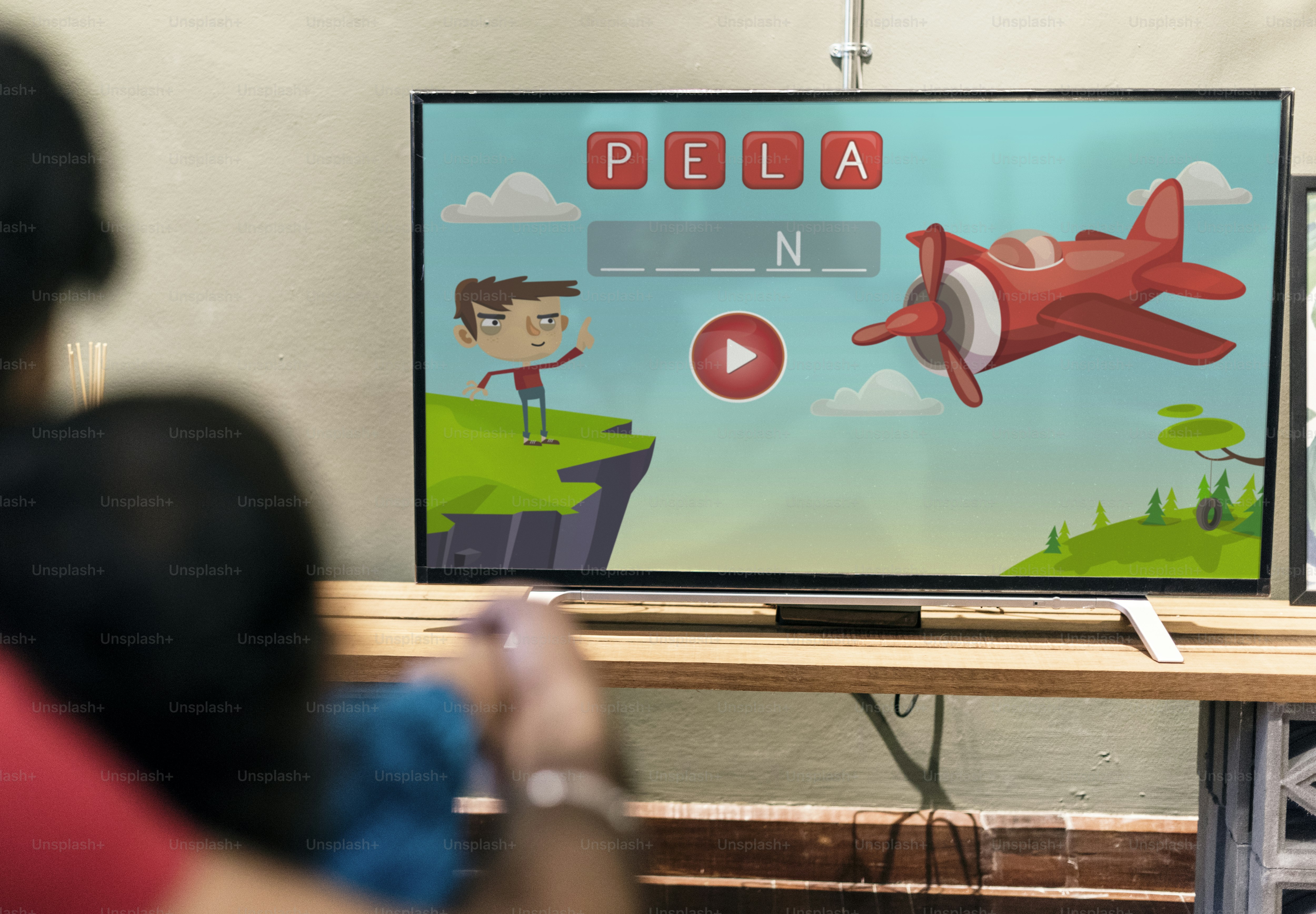 Young Indian boy watching television