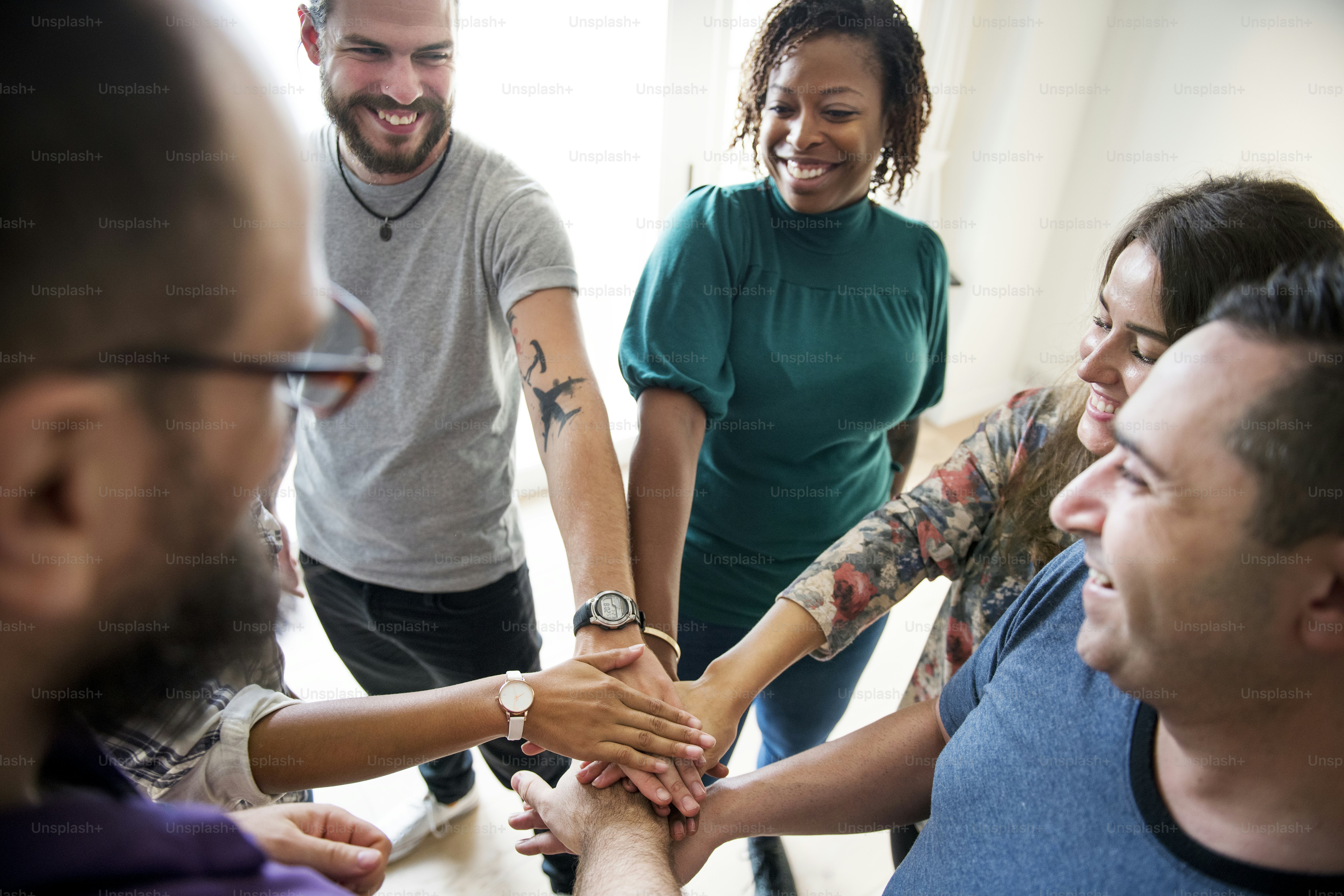 Group of diverse people joined hands together teamwork photo ...