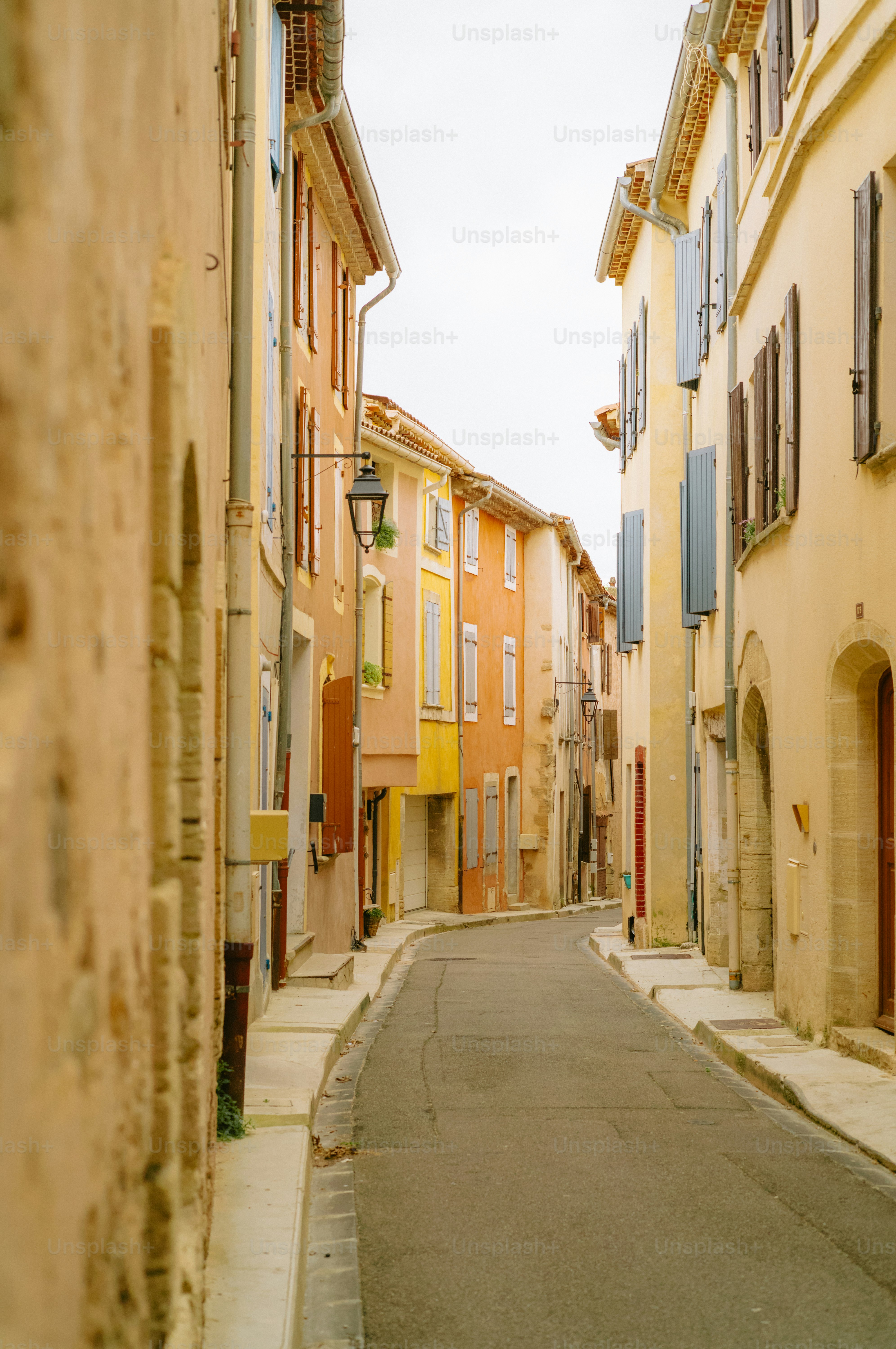 Narrow street lined with colorful buildings in a european town.
