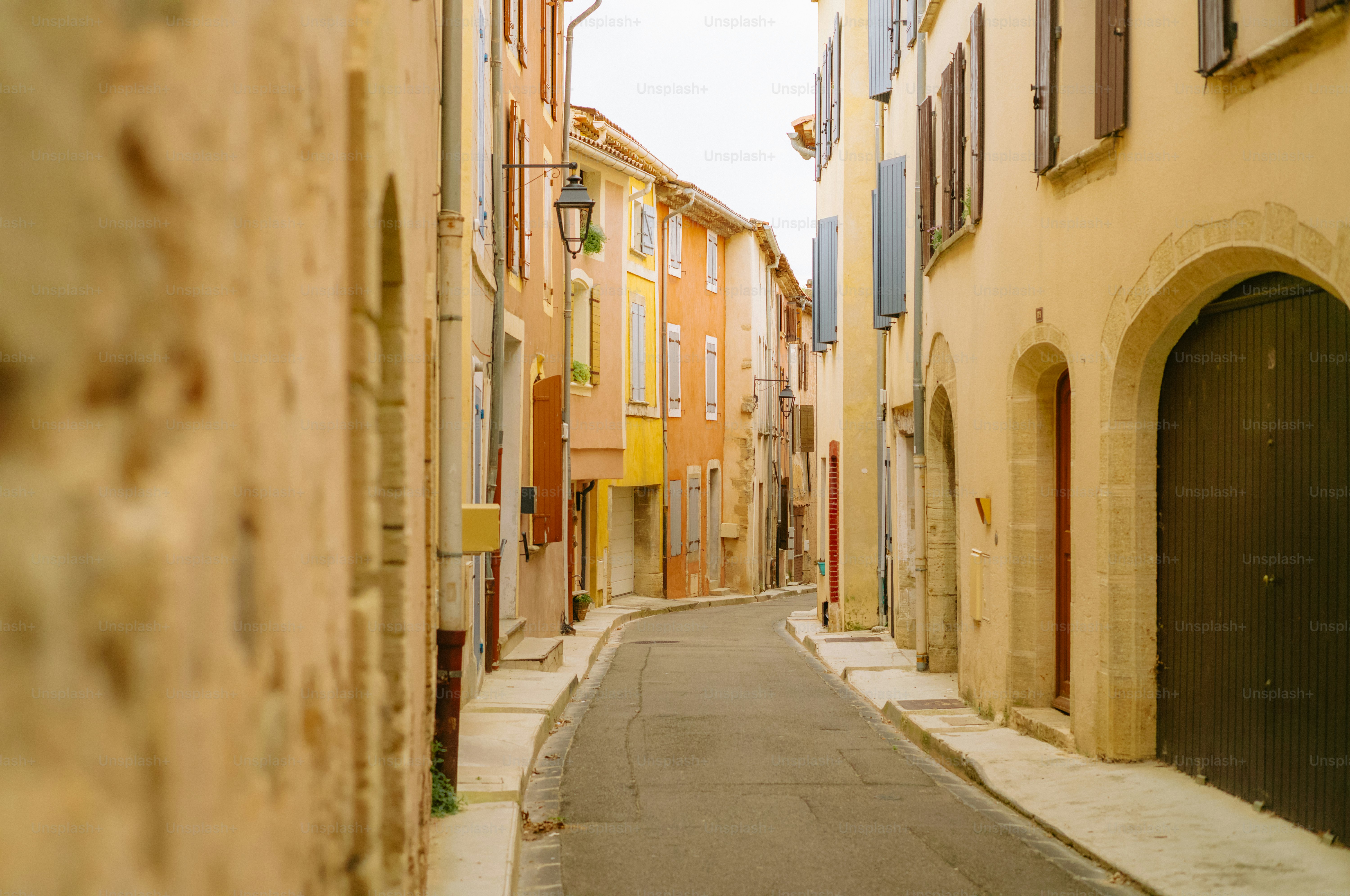 Narrow street lined with colorful buildings in a european town.