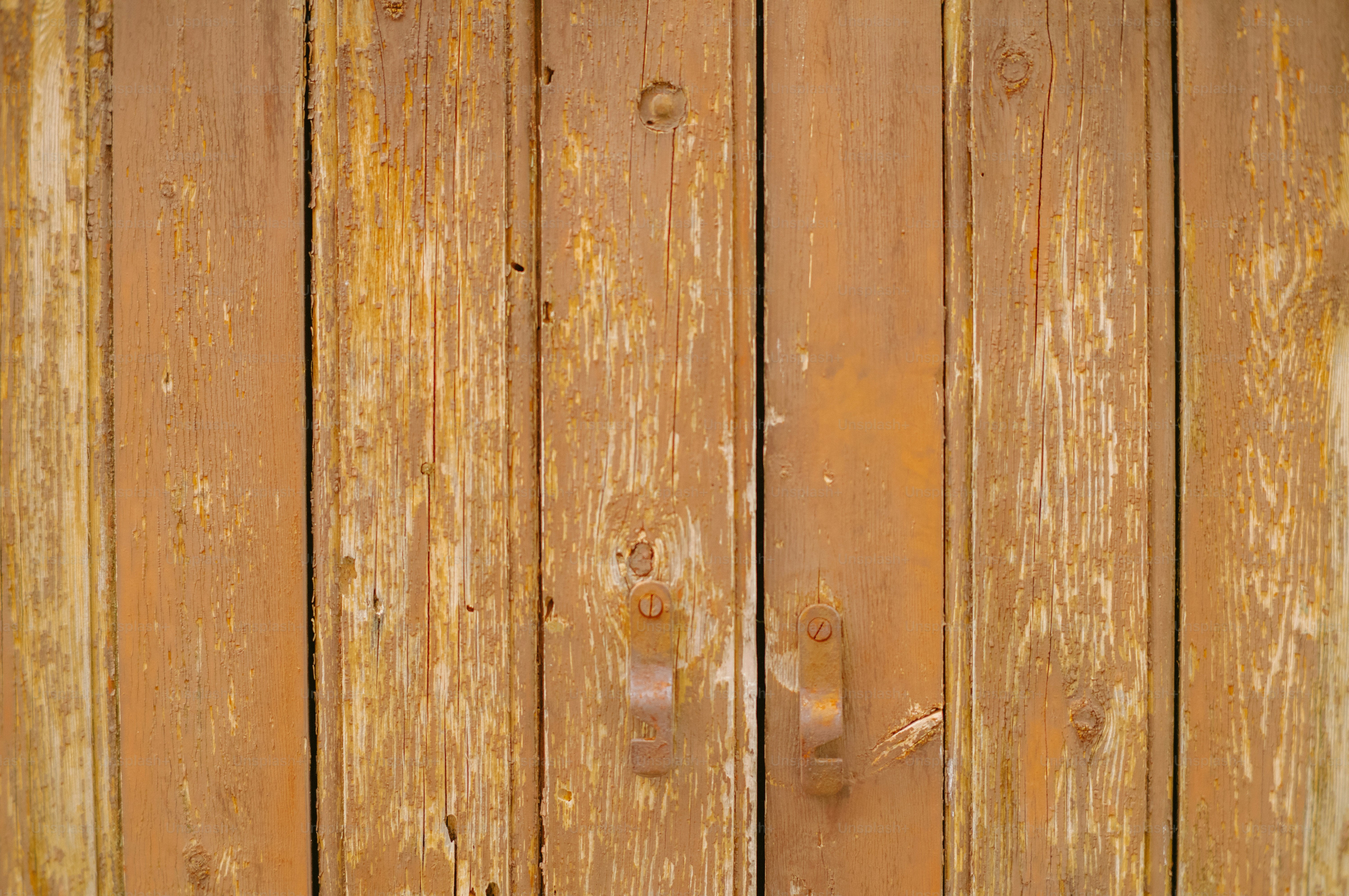 Weathered wooden doors with distressed paint texture