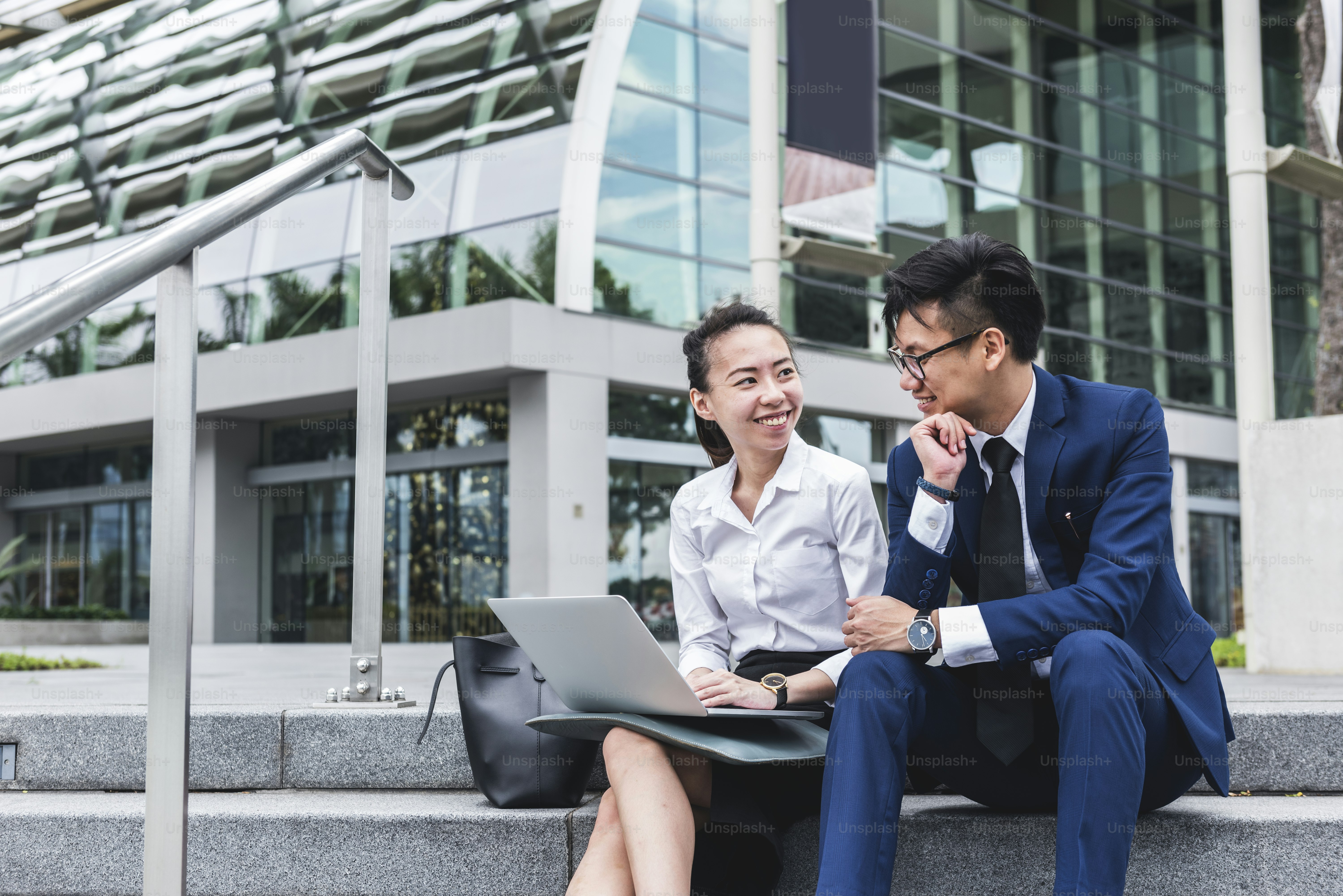 Asian business people working together in a city