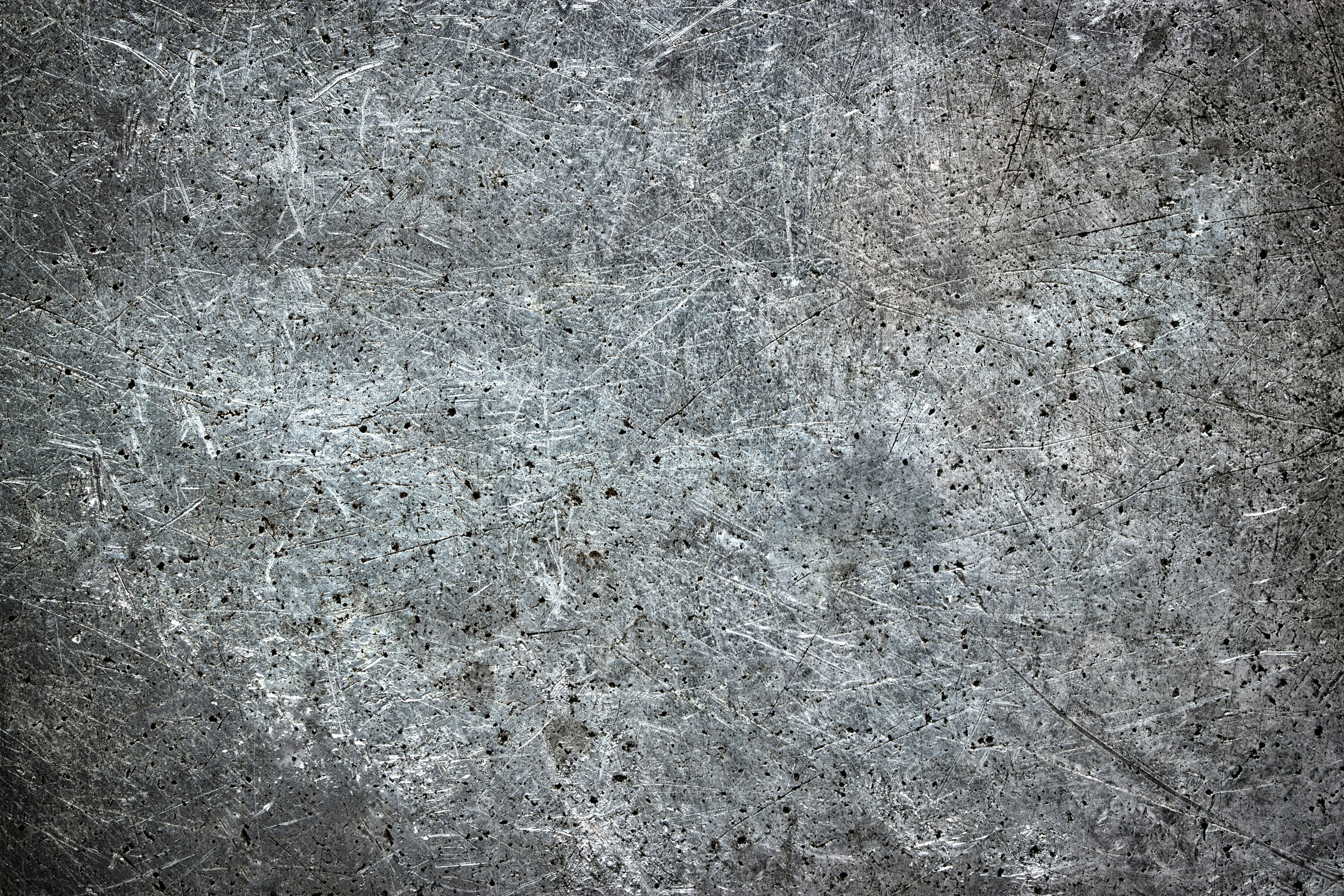 Dirty mettalic background with scuffs, iron texture with brushes from brush