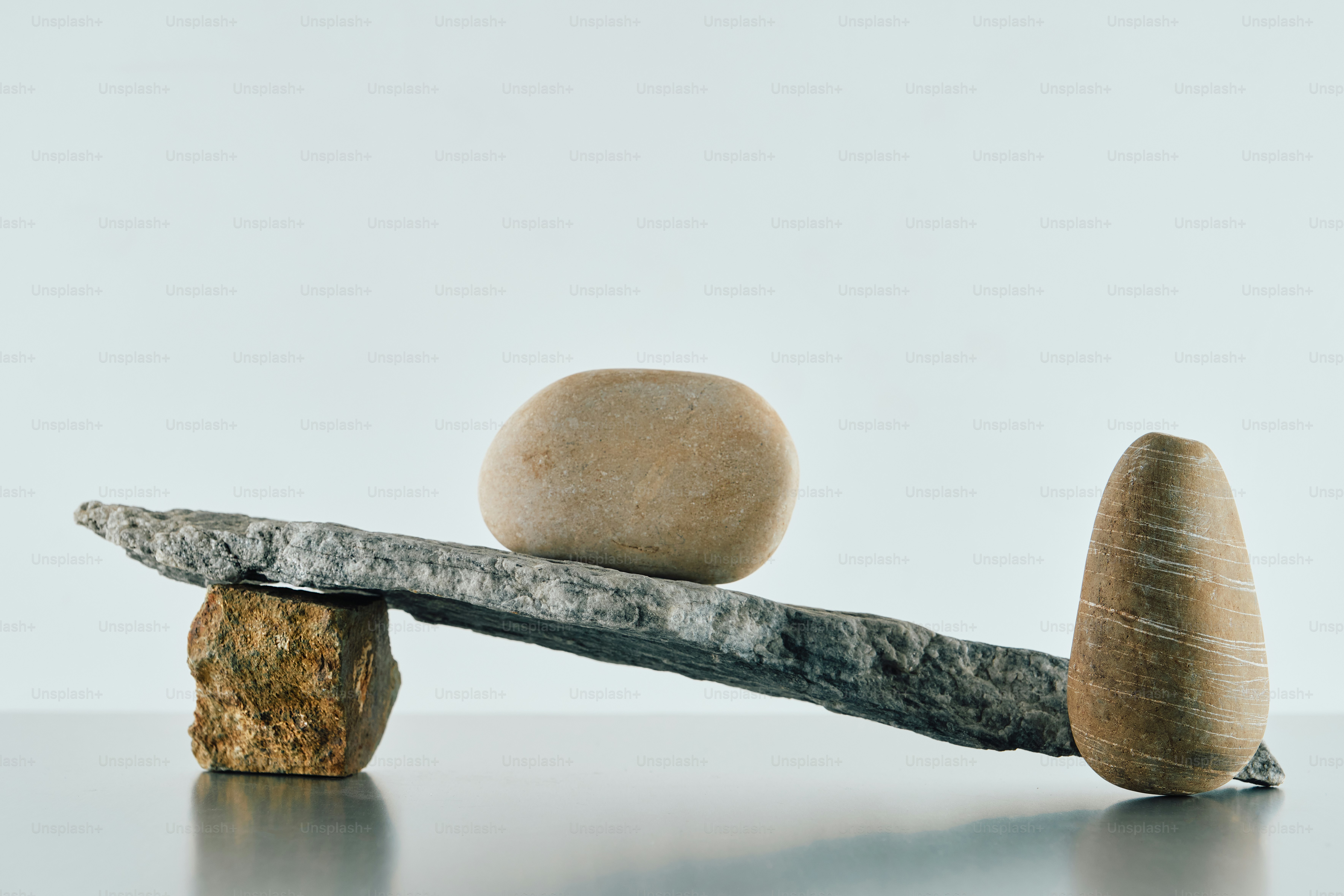 Two rough stones against a black background. photo – Background Image ...