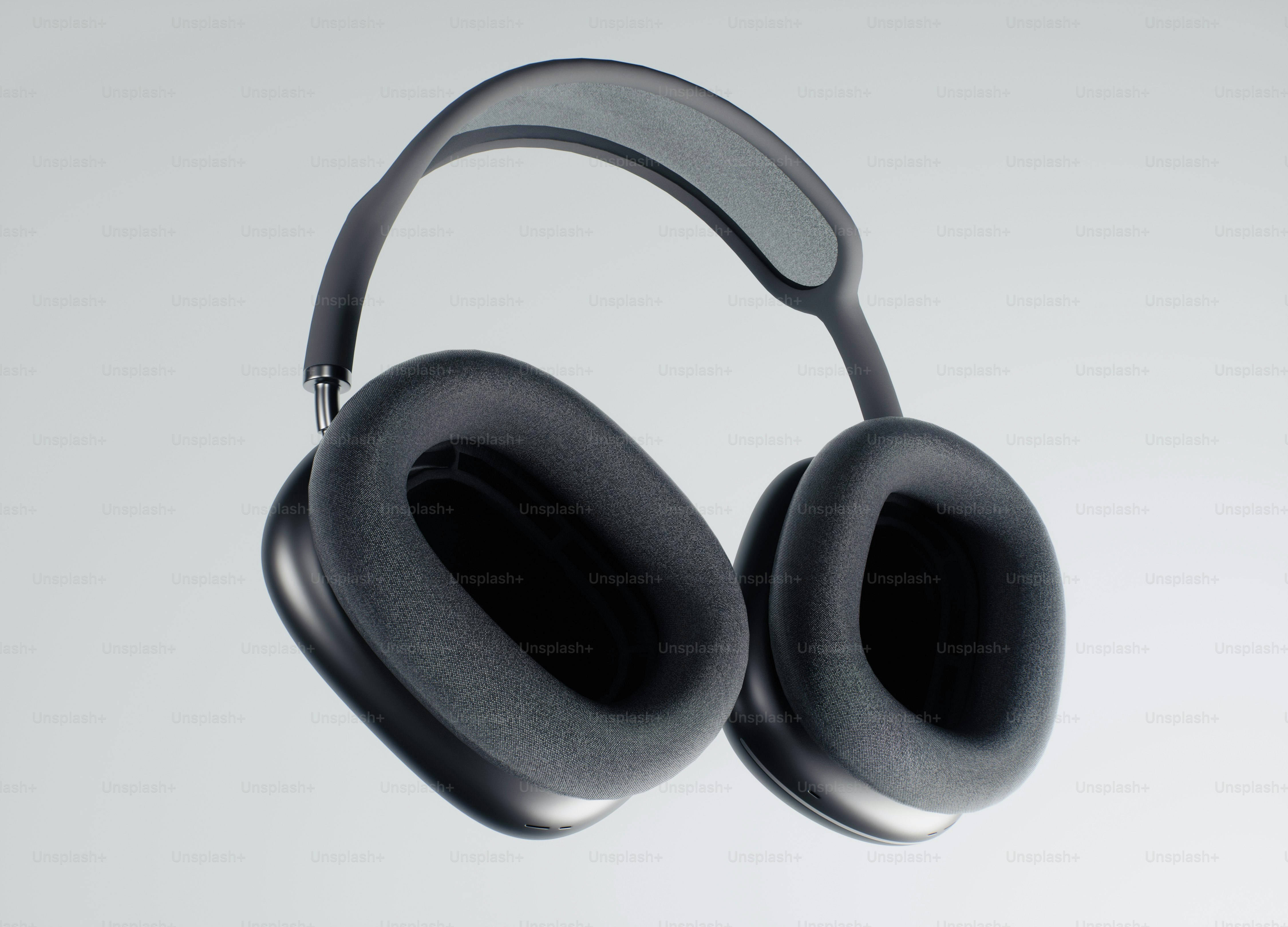 Black over-ear headphones on a light gray background.
