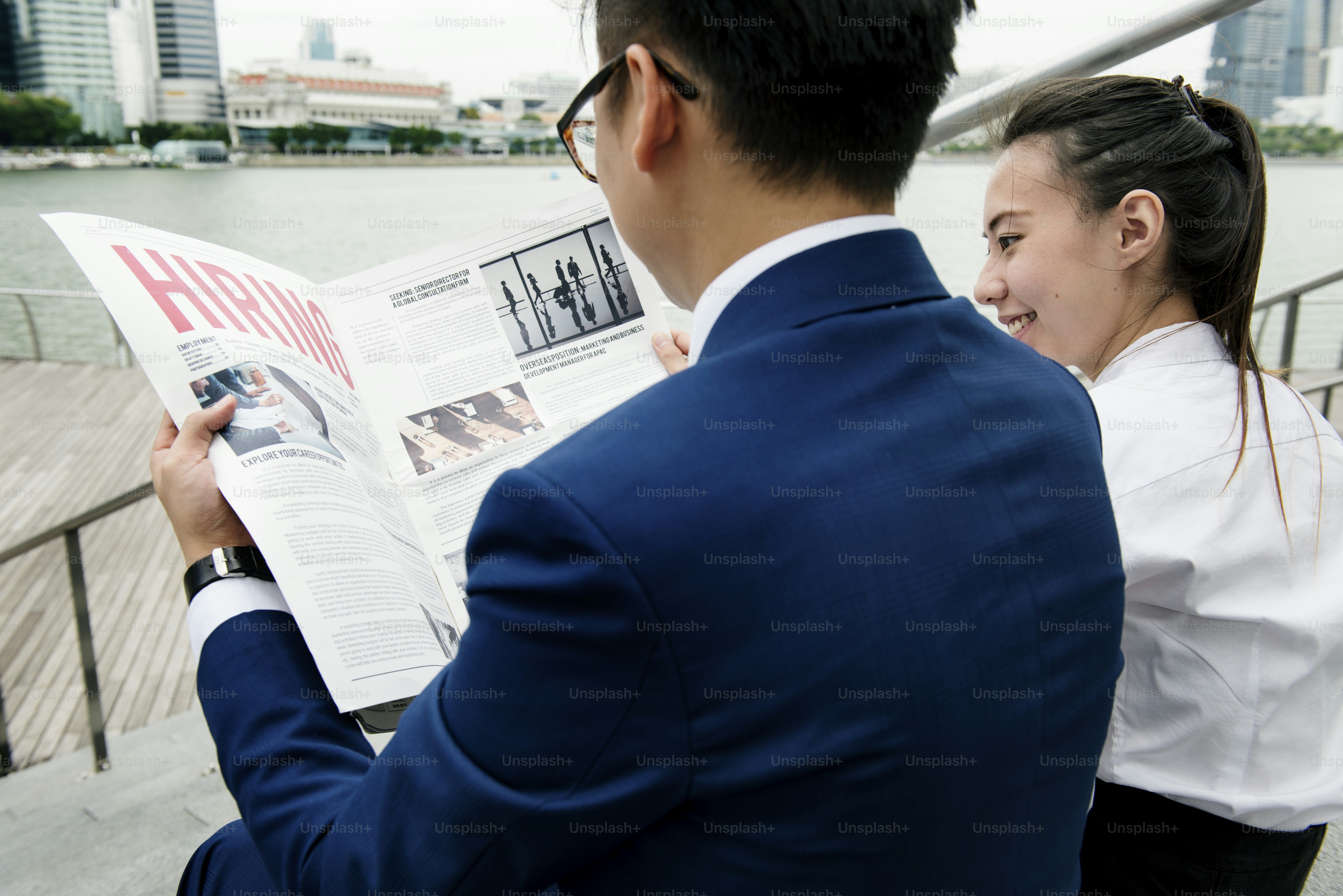 Asian business people in a city working together