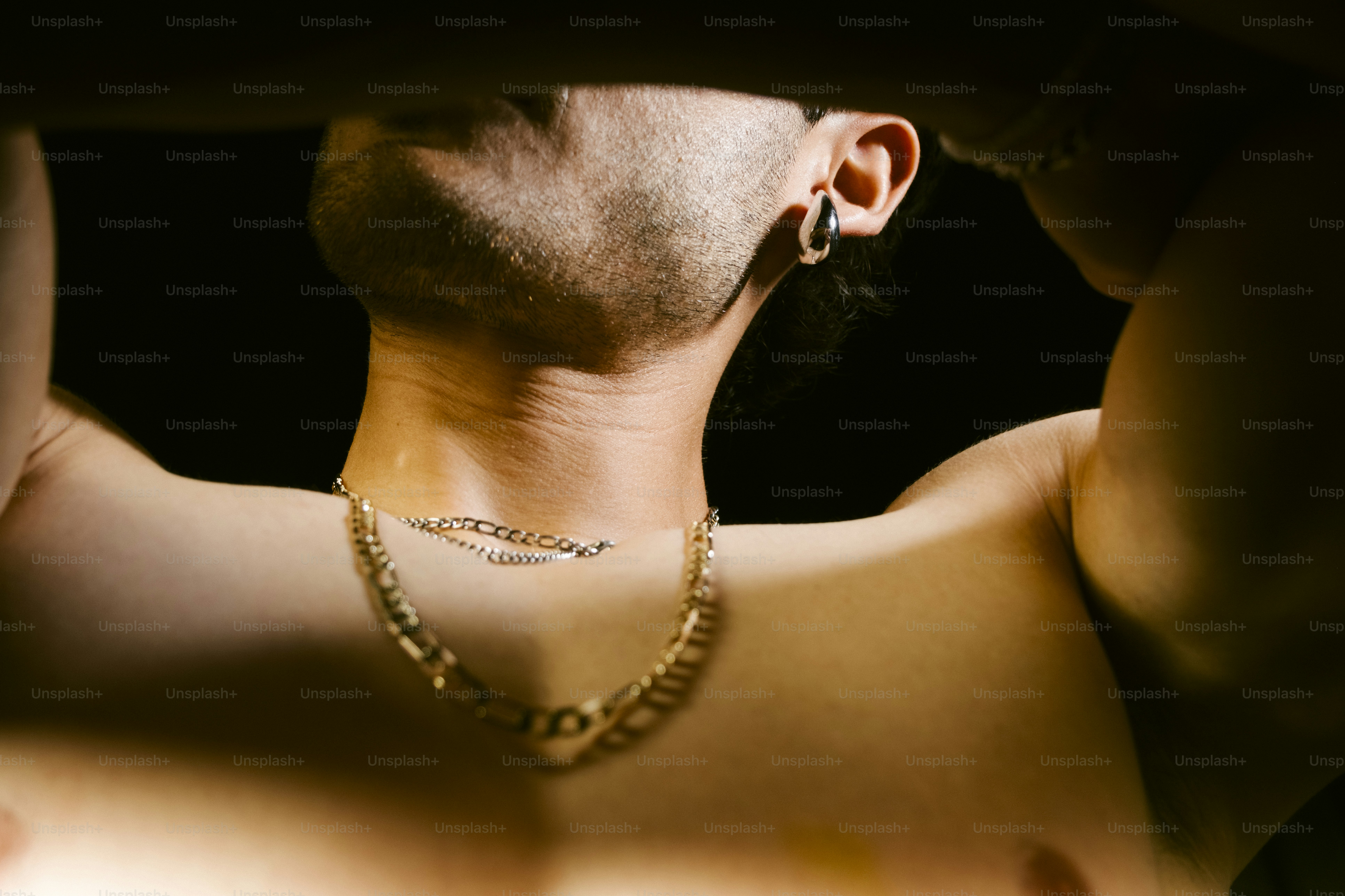 Man with gold chain and earring