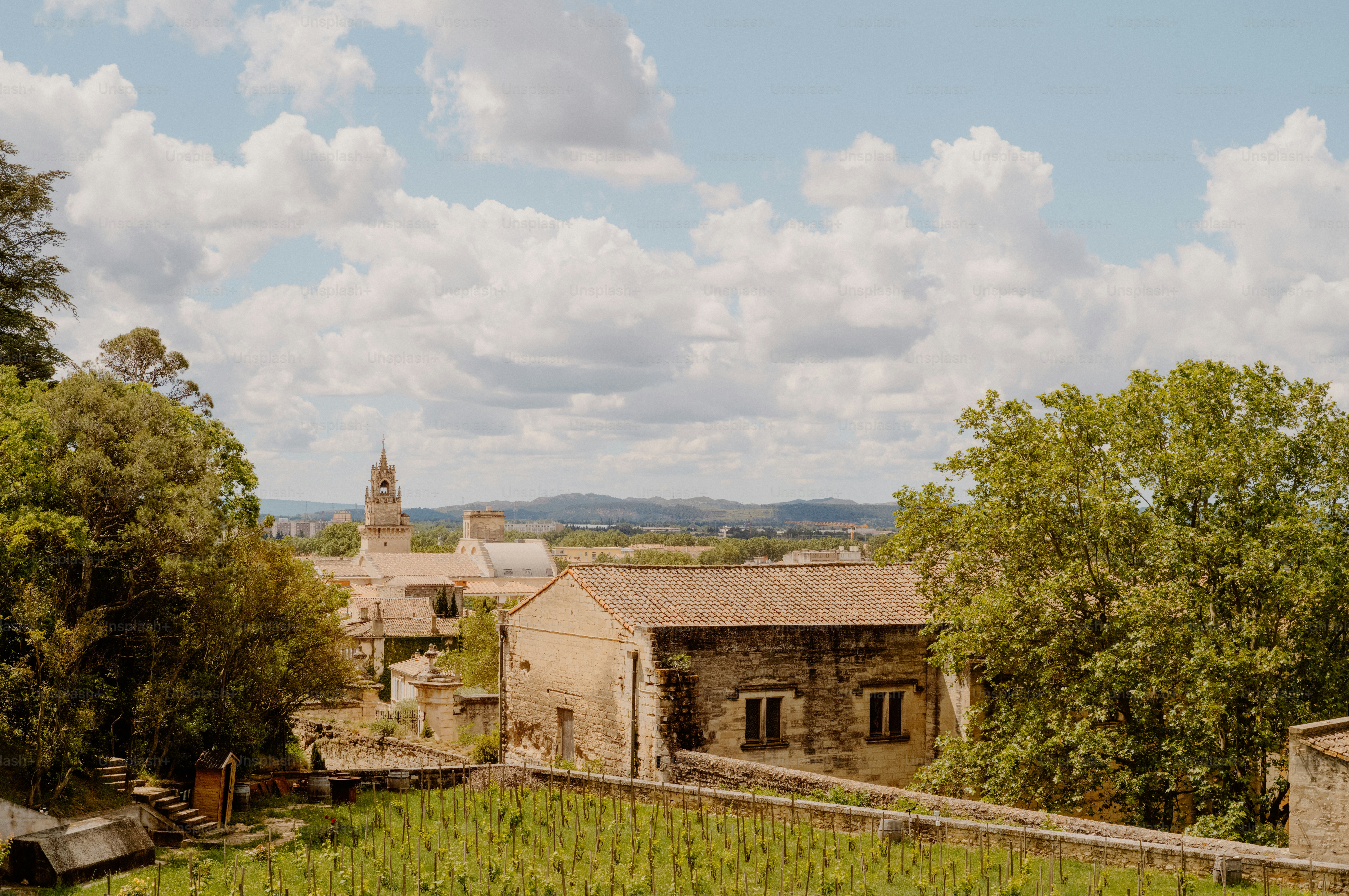 Village buildings with a church steeple under clouds
