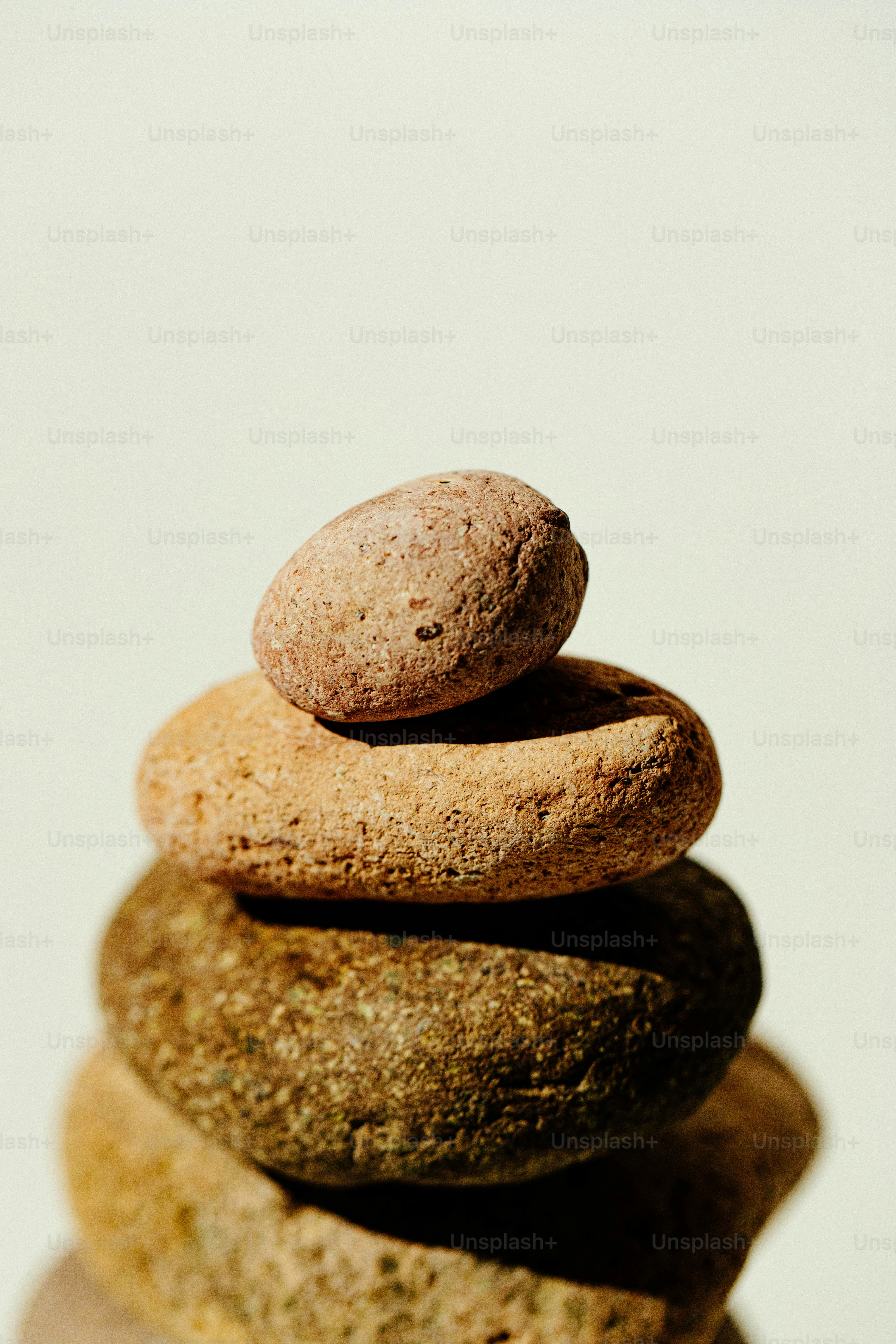 Seven smooth, natural stones balanced in a stack. photo – Meditation ...