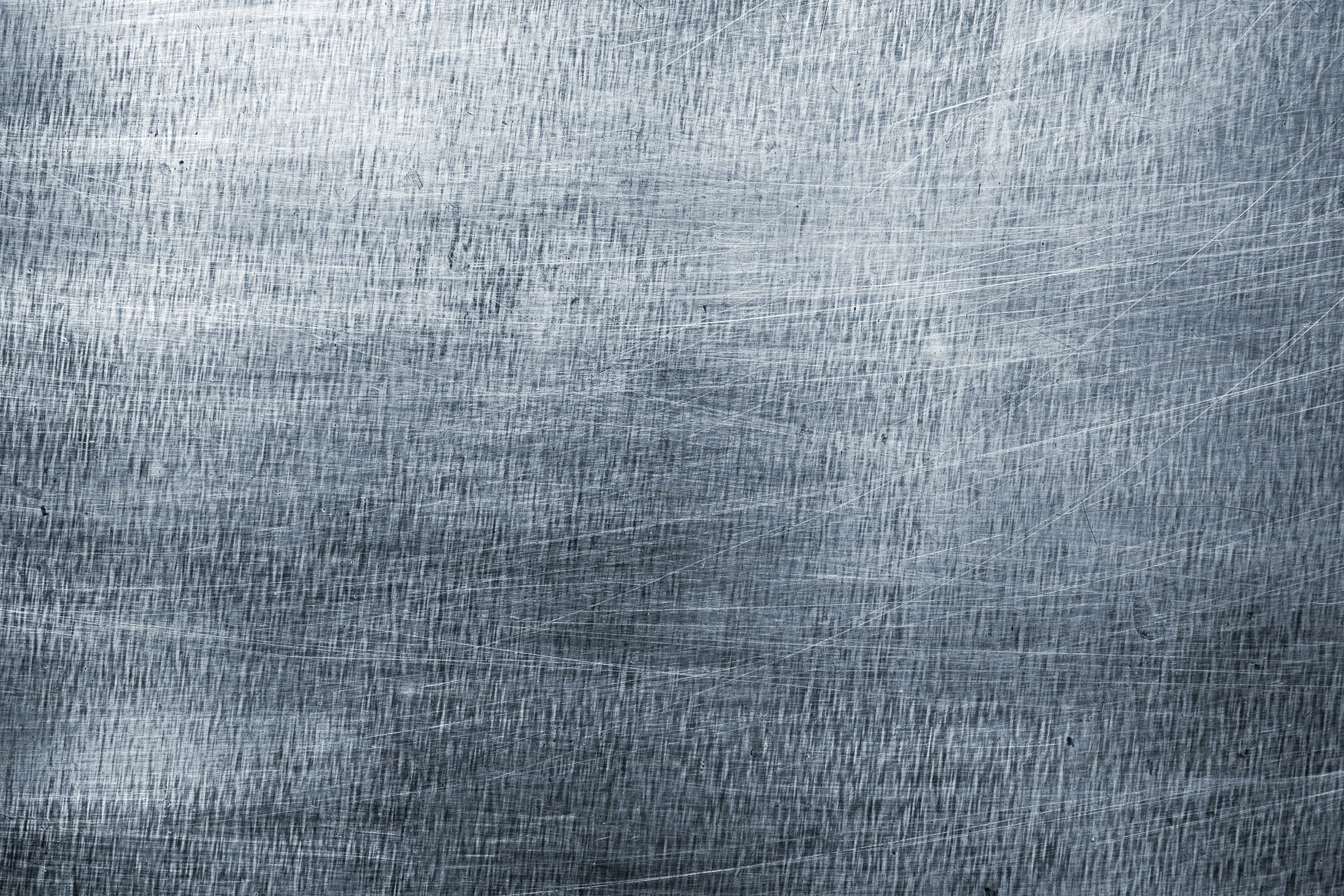Silver metal background, steel sheet with a brush pattern