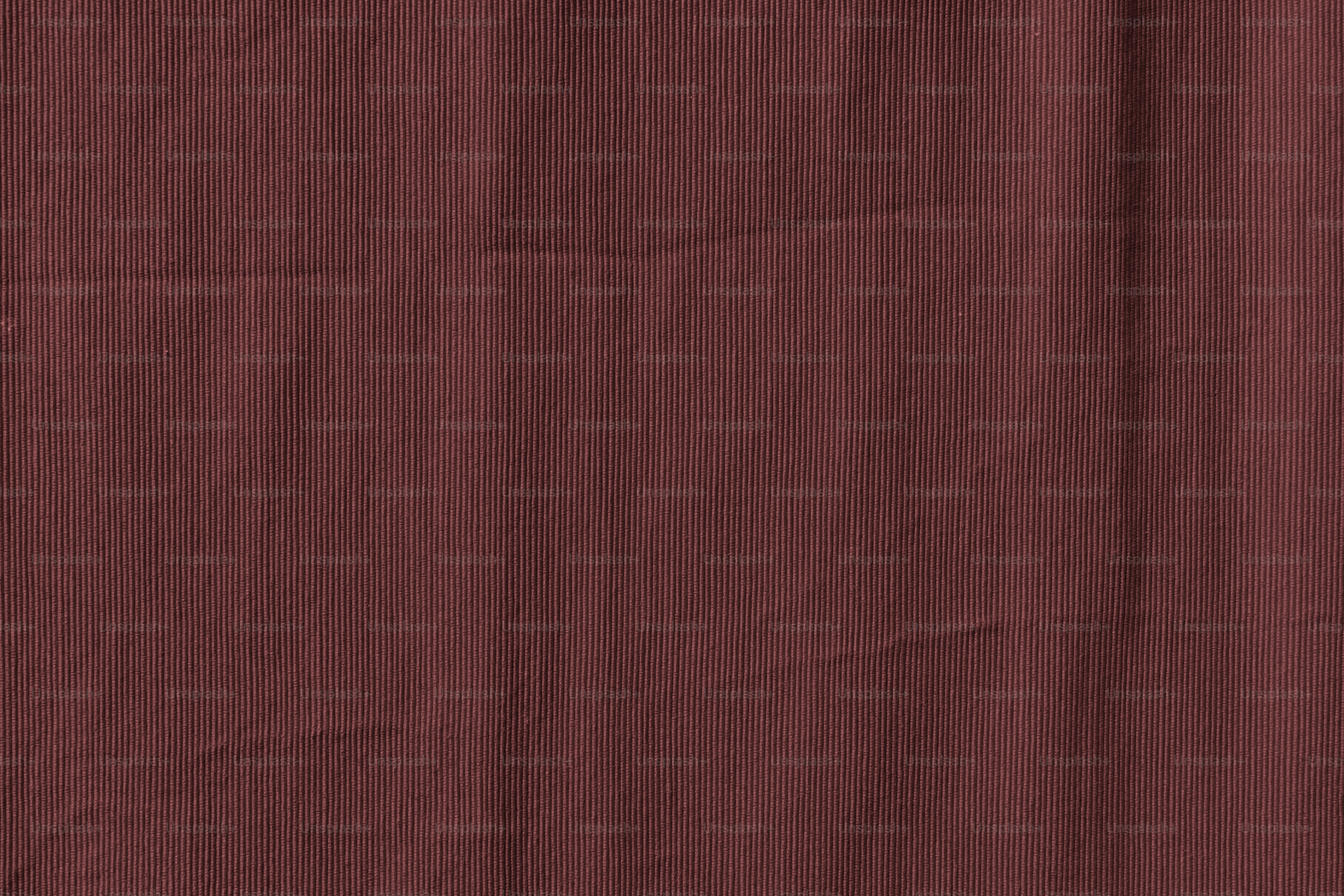A solid dark maroon background with subtle texture. photo – Wallpaper ...