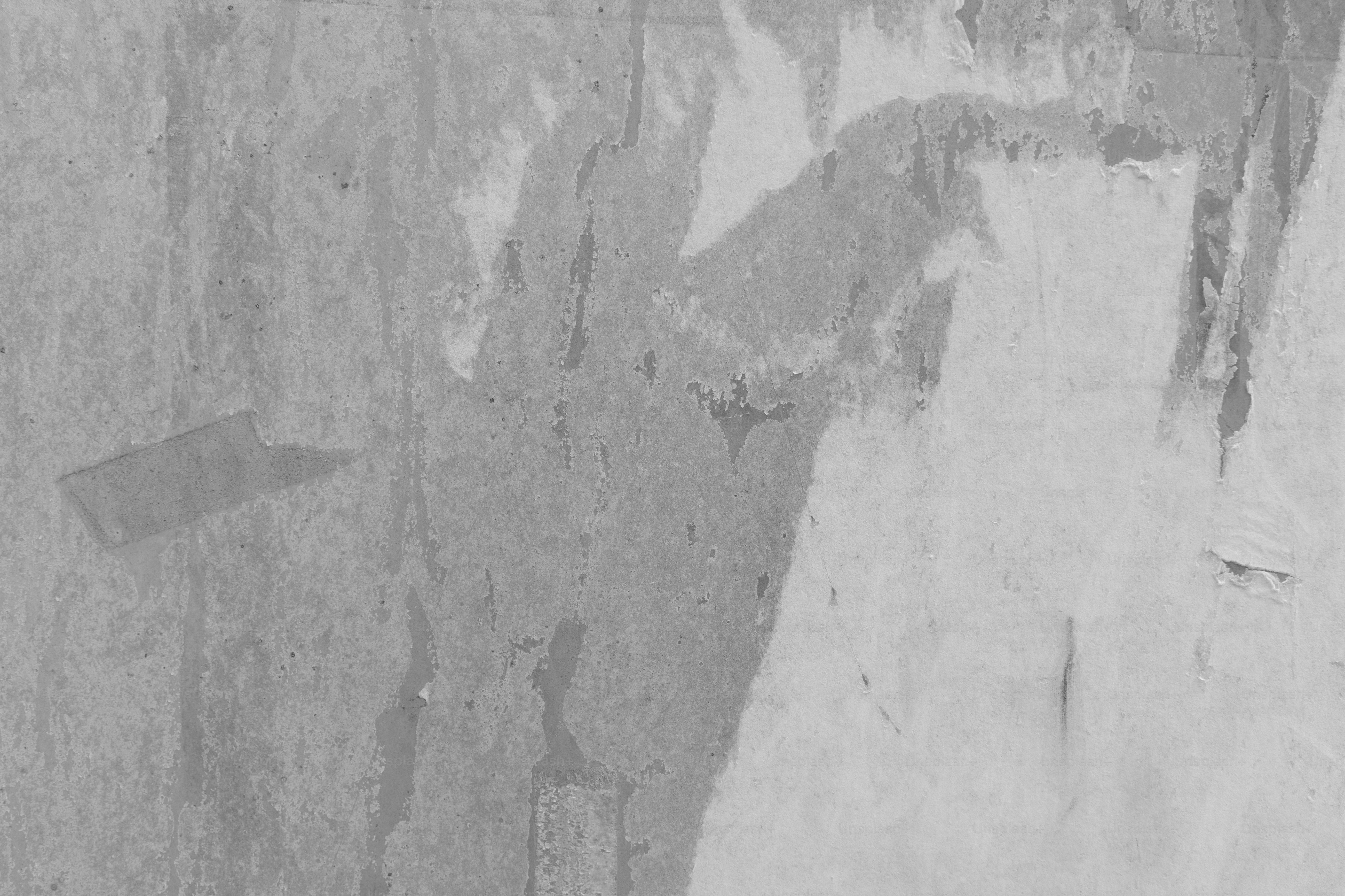 Distressed gray wall with torn paper remnants and texture - Photo on ...