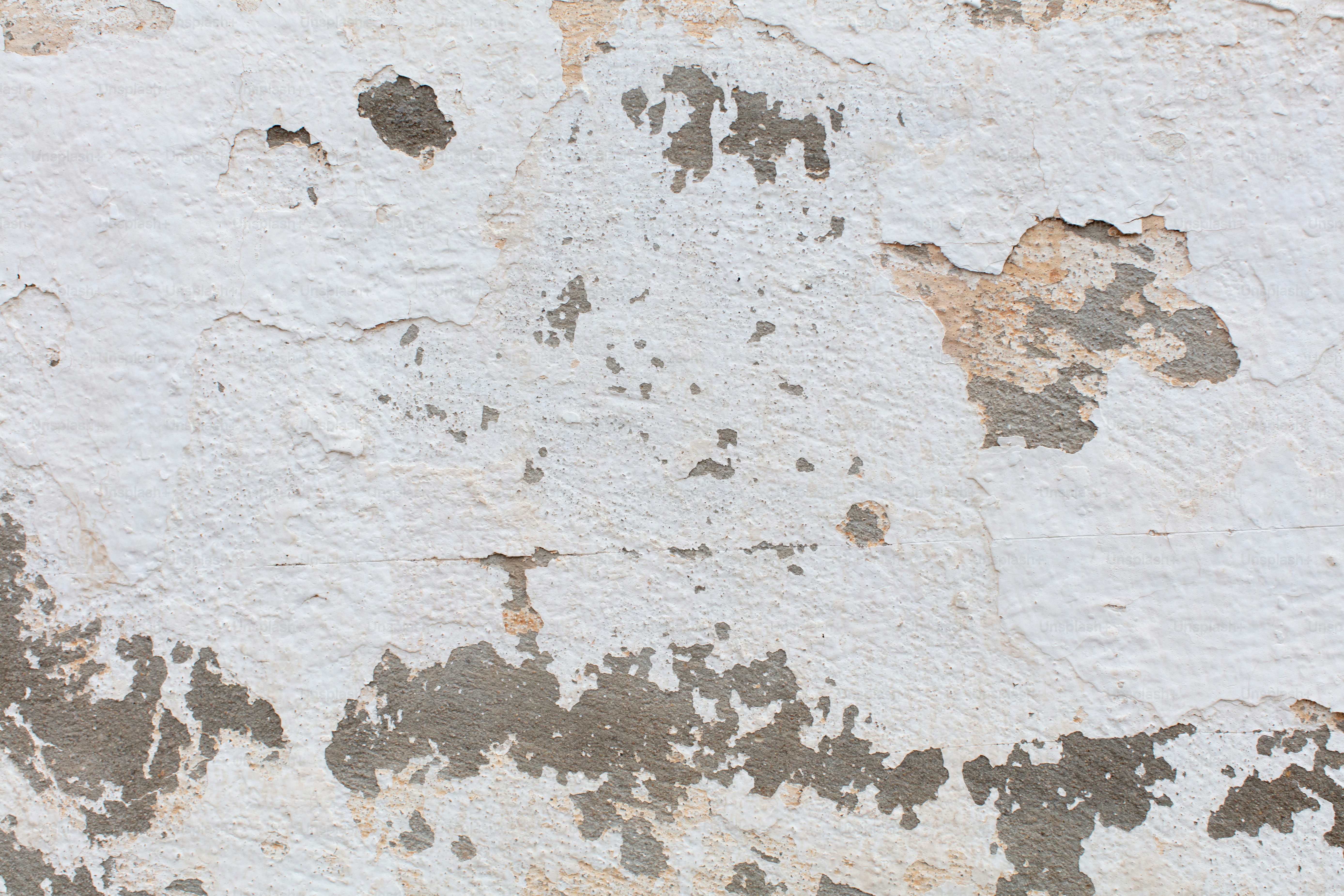 Distressed gray wall with torn paper remnants and texture - Photo on ...