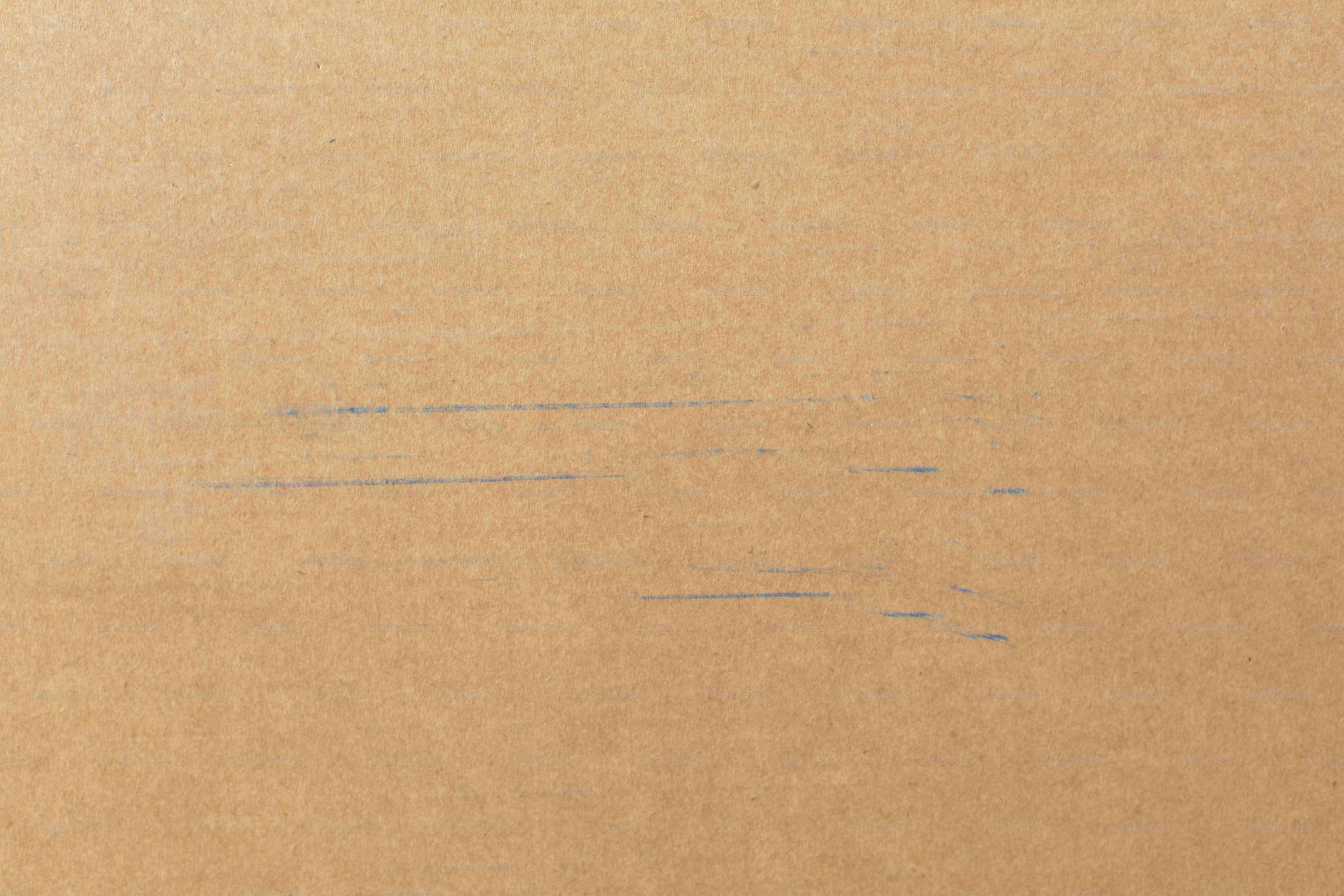 Light brown surface with faint horizontal scratch marks. photo ...