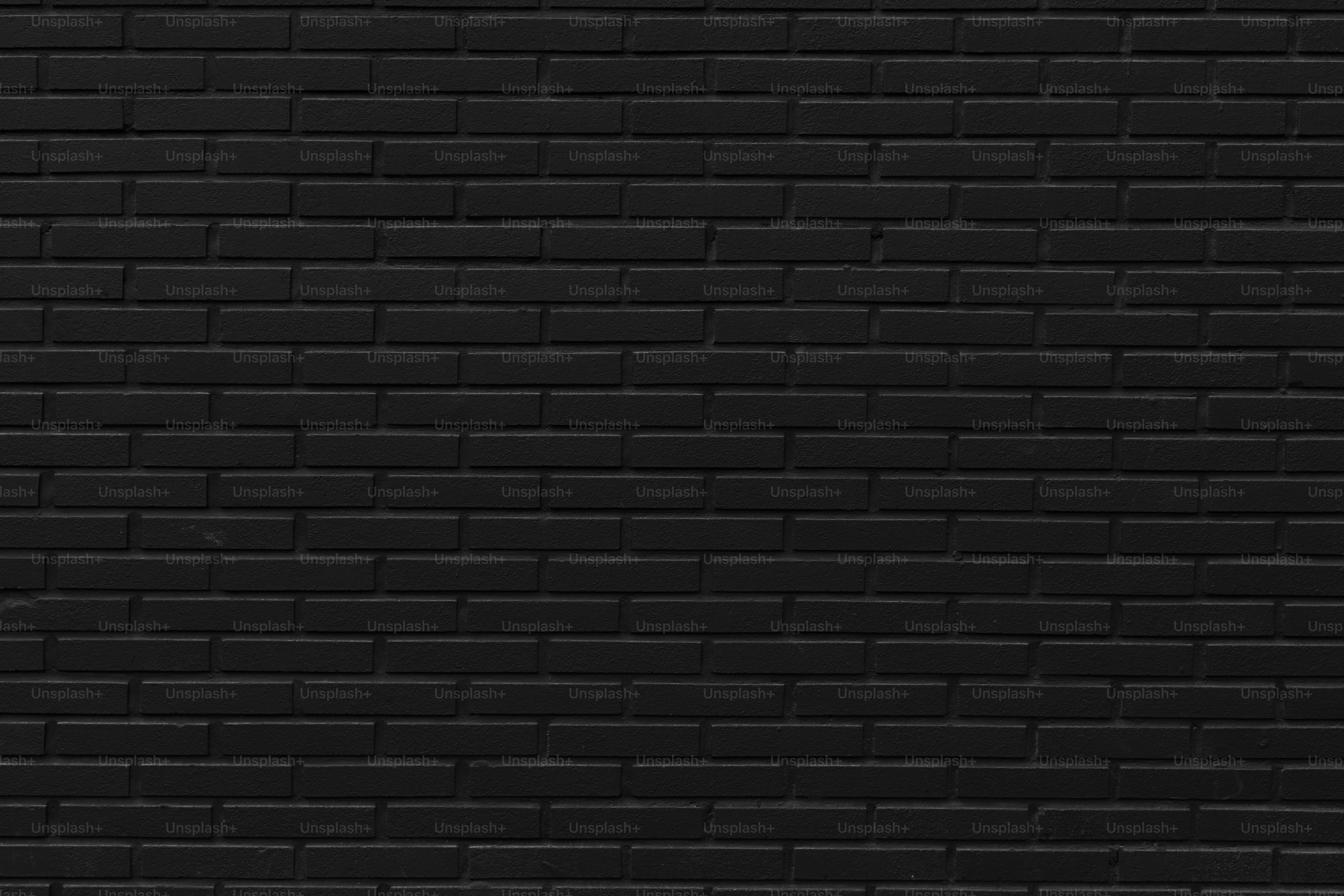 A solid black brick wall texture