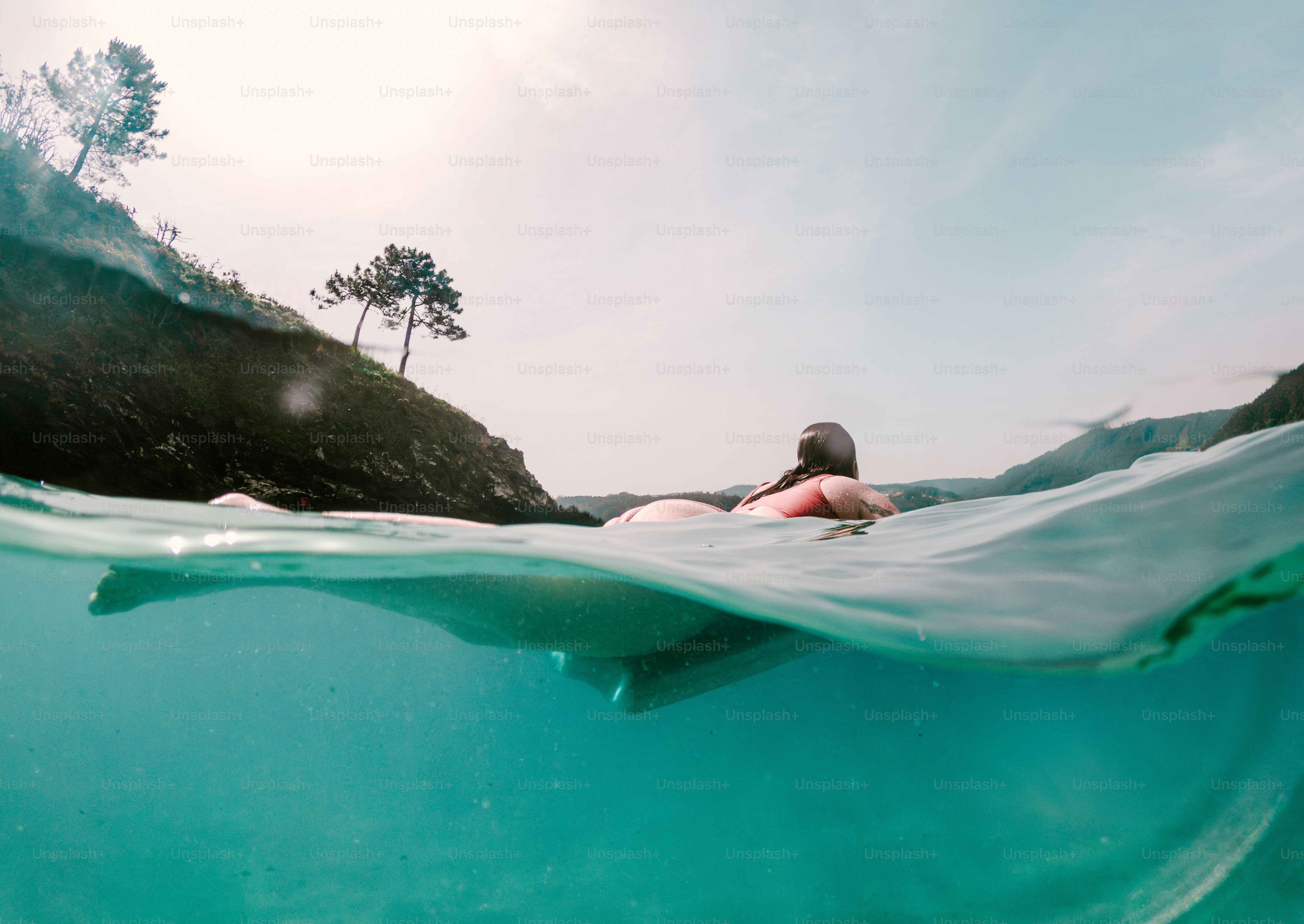 Woman on raft in clear blue water, sunny coast. photo – Travel Image on ...