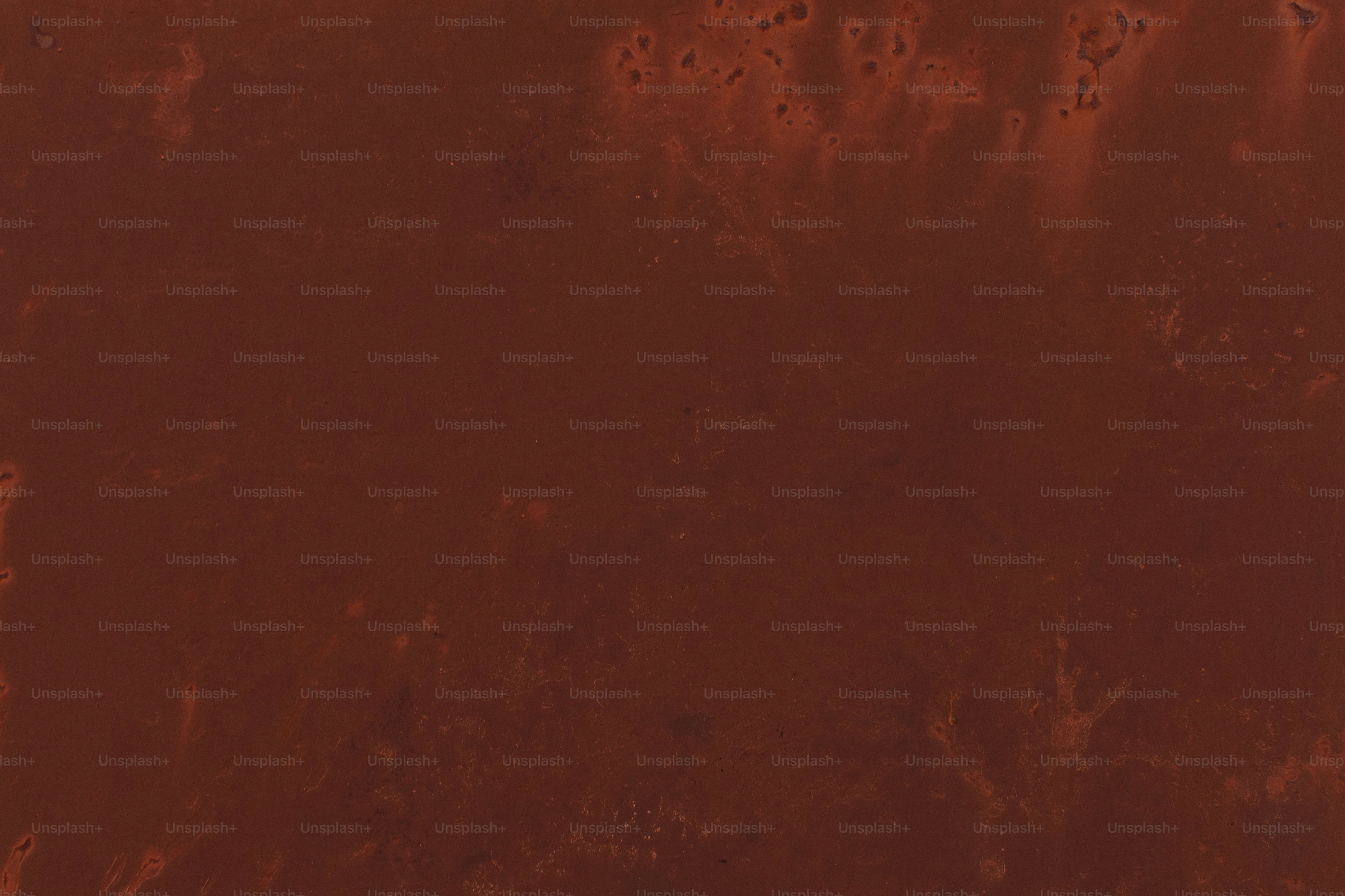 Dark reddish-brown textured background