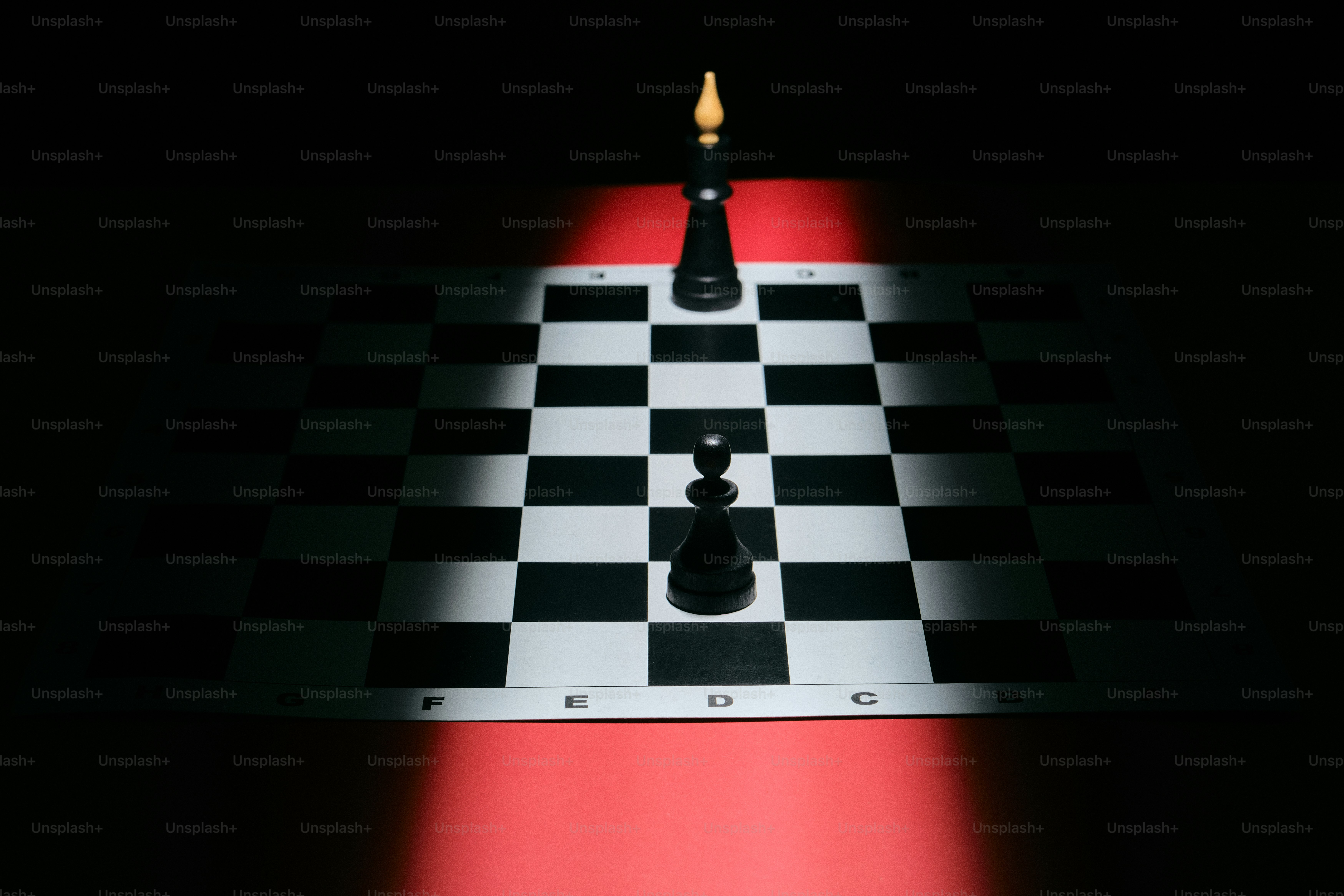 Black chess pawn and white eraser connected by red string. photo ...