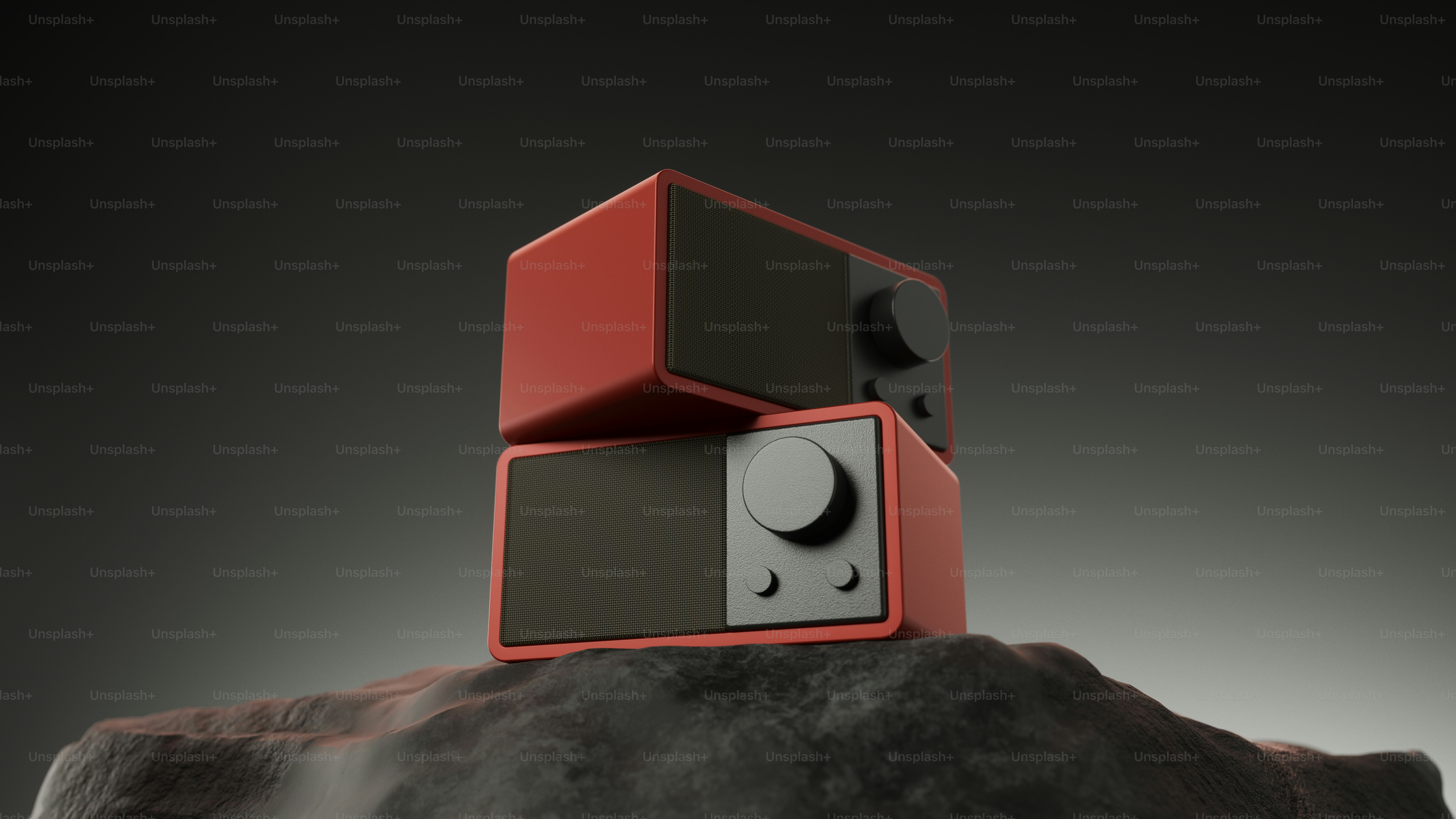 A black speaker stands on a concrete surface. photo – Technology Image ...